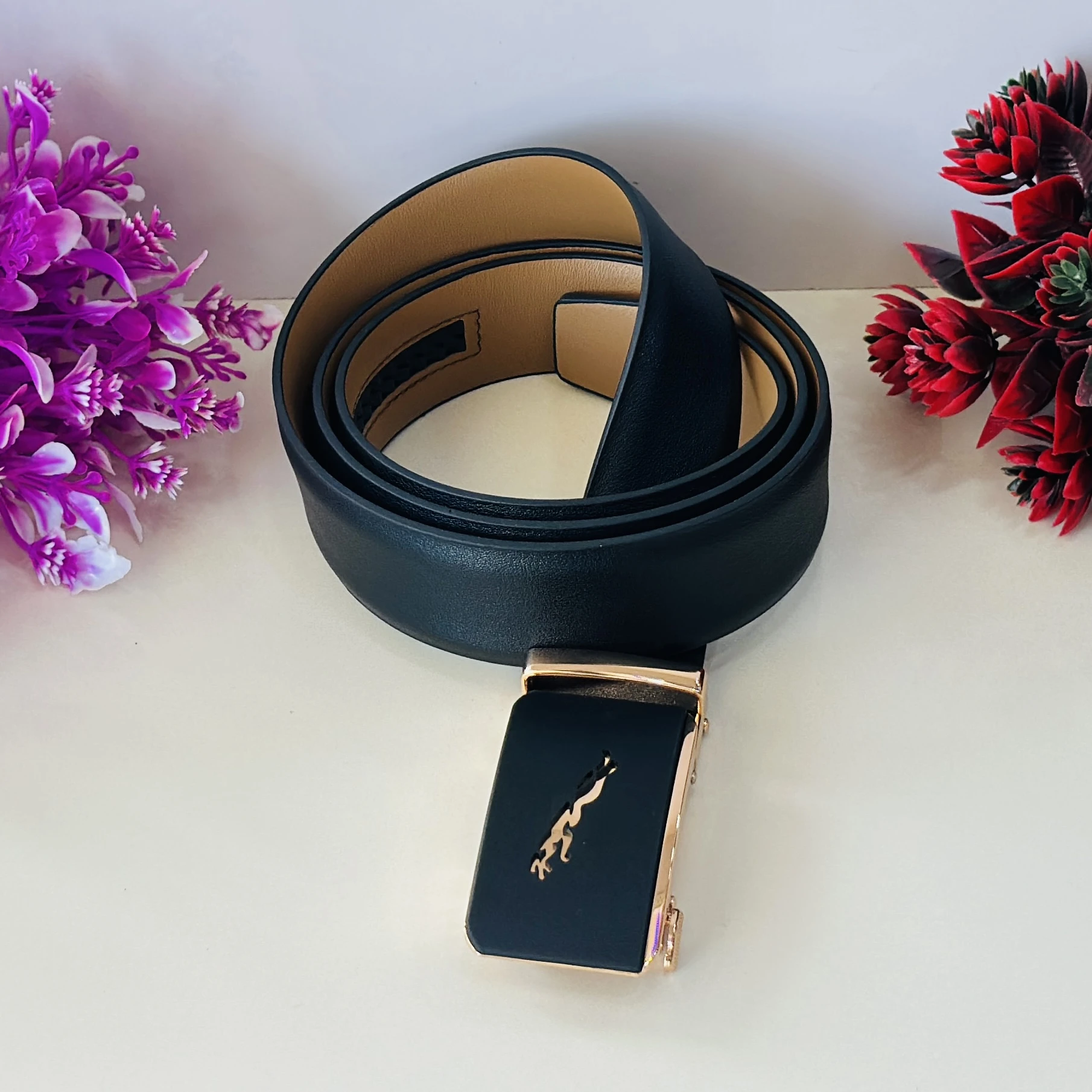 Black genuine or synthetic leather men's belt