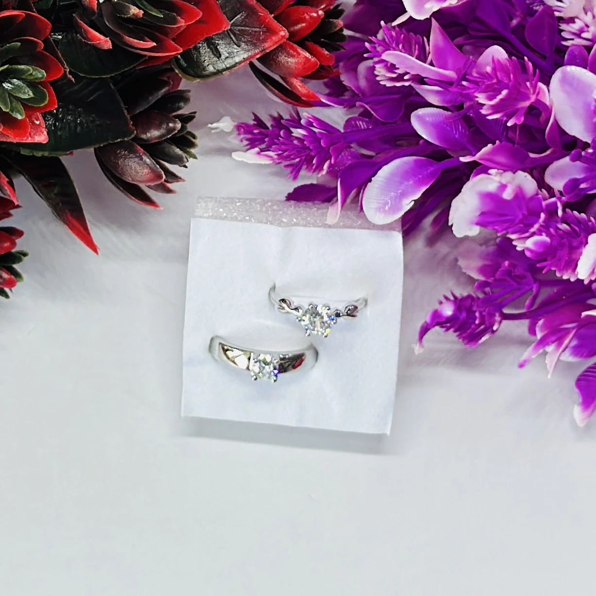 set of silver-plated, stone-studded, adjustable couple rings.