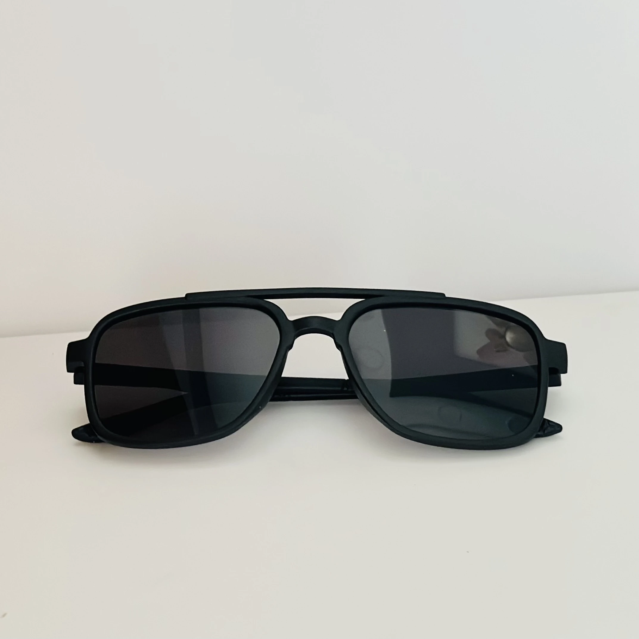 Vincent Chase black round sunglasses.