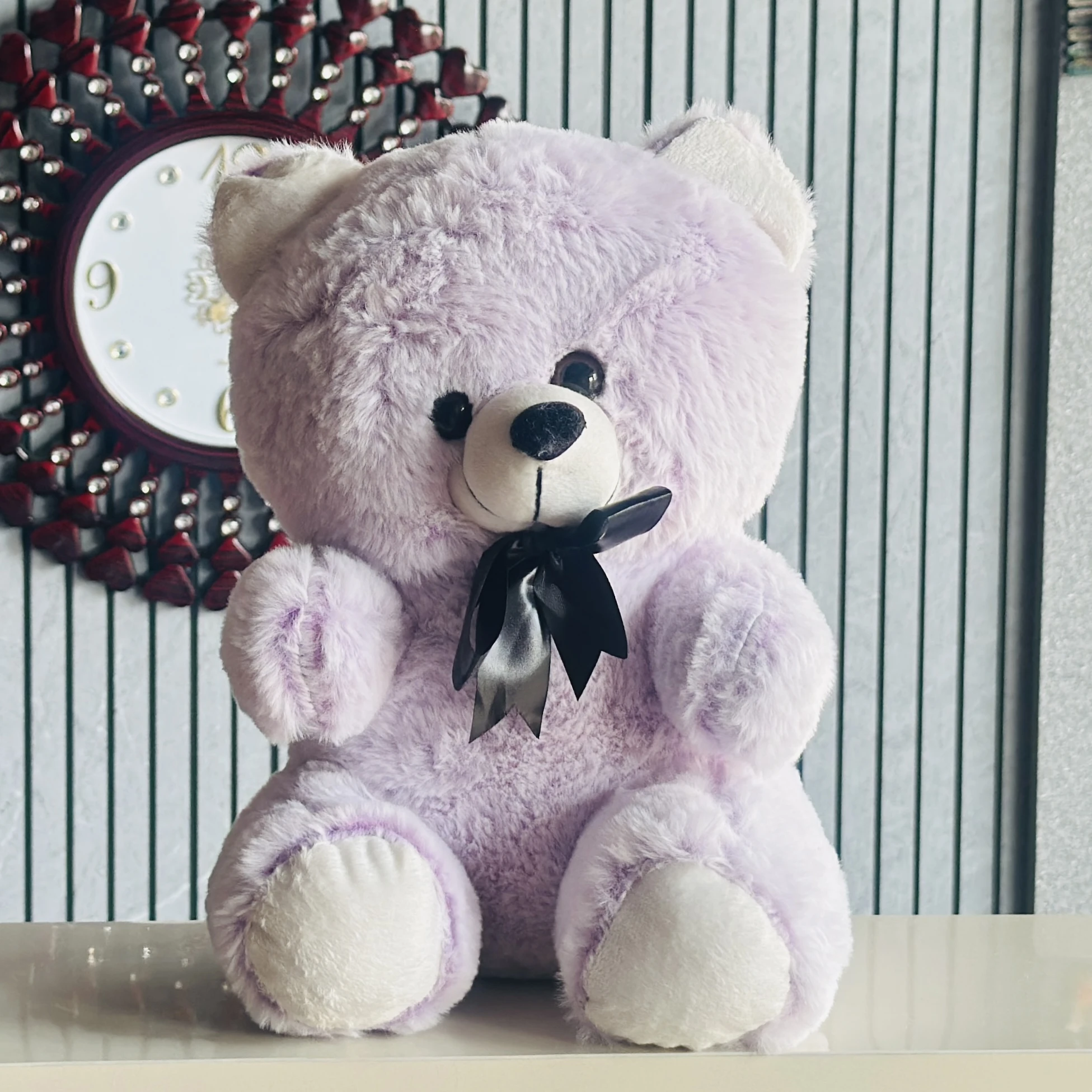 Soft purple plush teddy bear.
