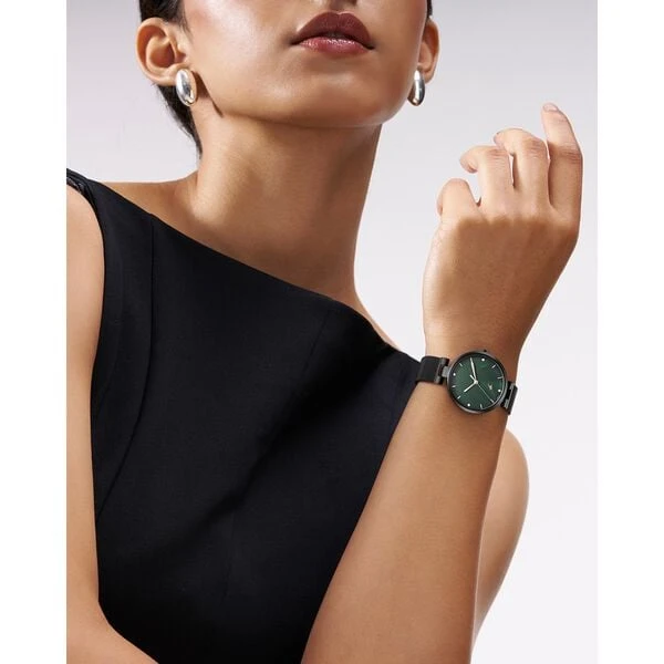 Fastrack Stunners X analog watch, featuring a striking green mother-of-pearl dial paired with a dark mesh stainless steel stra