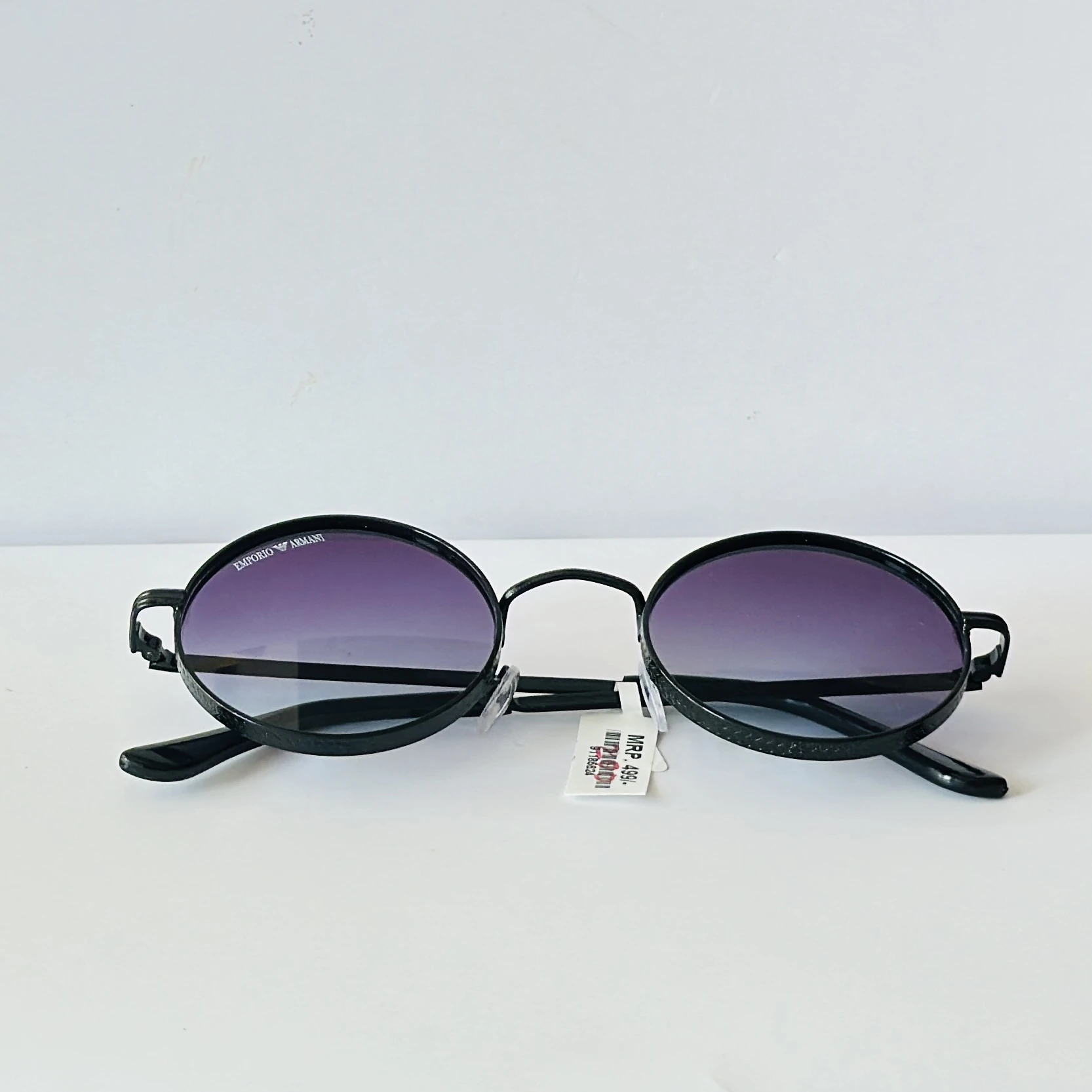 pair of round purple-tinted sunglasses