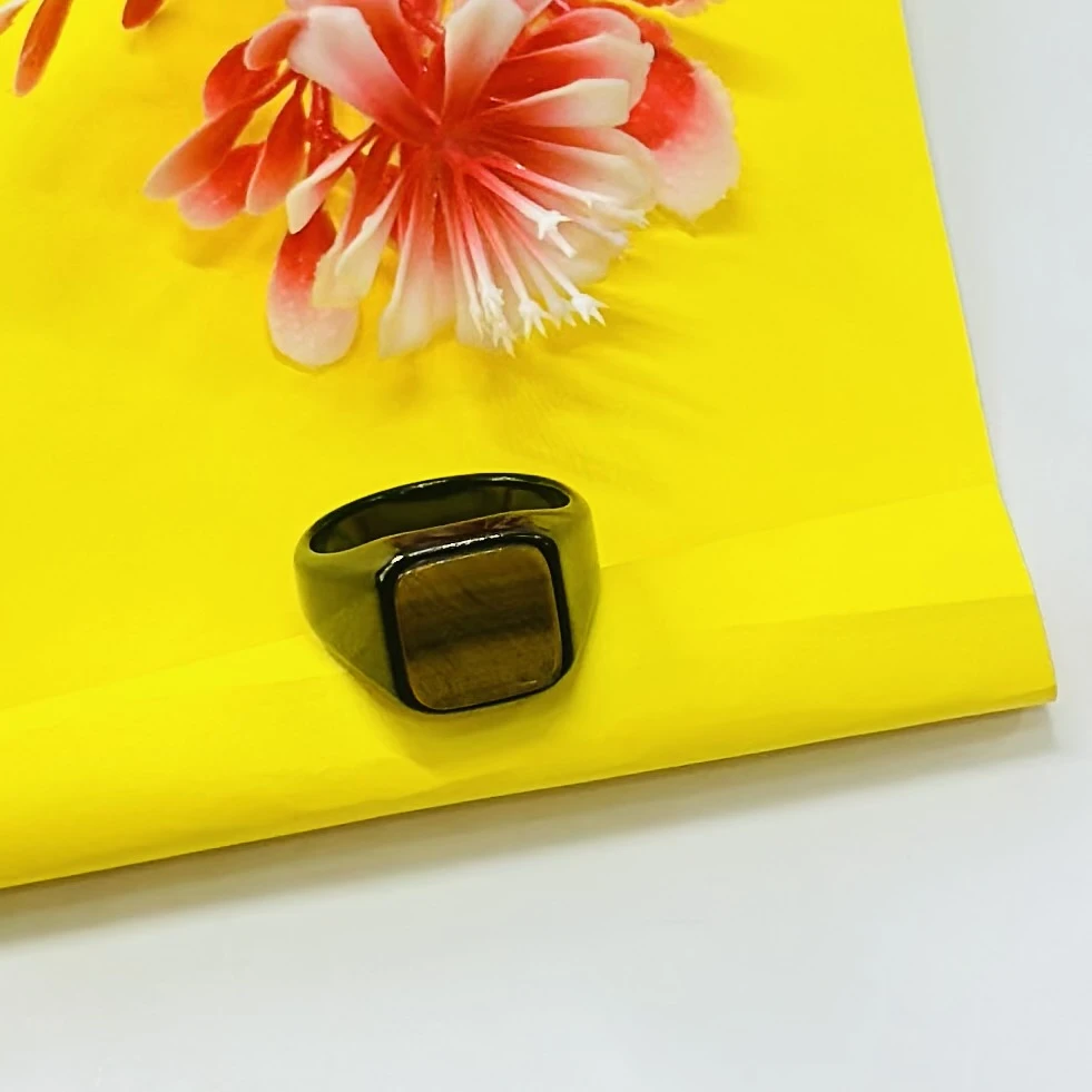 Chimes stainless steel black ring with a square-shaped crystal.
