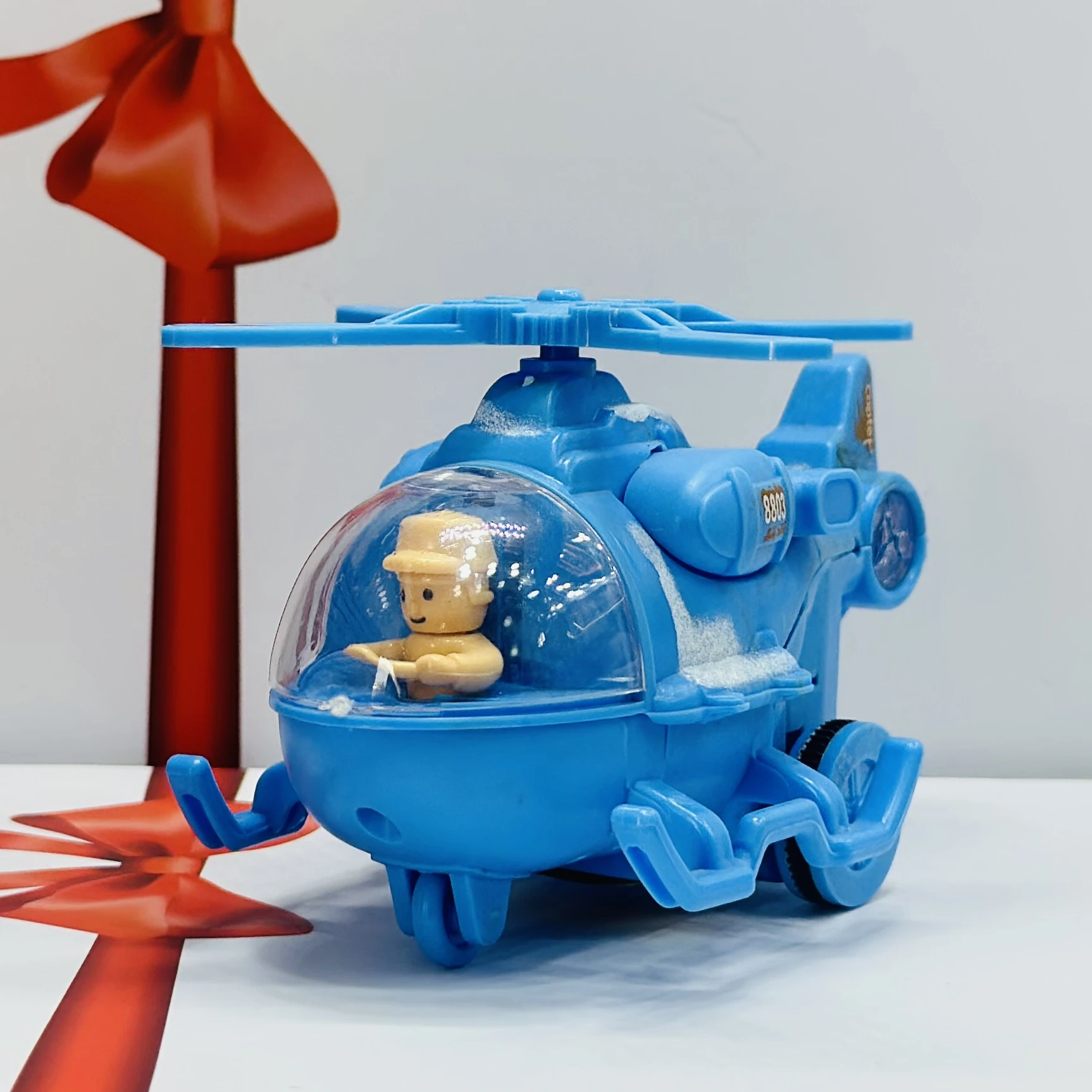 friction-powered toy helicopter
