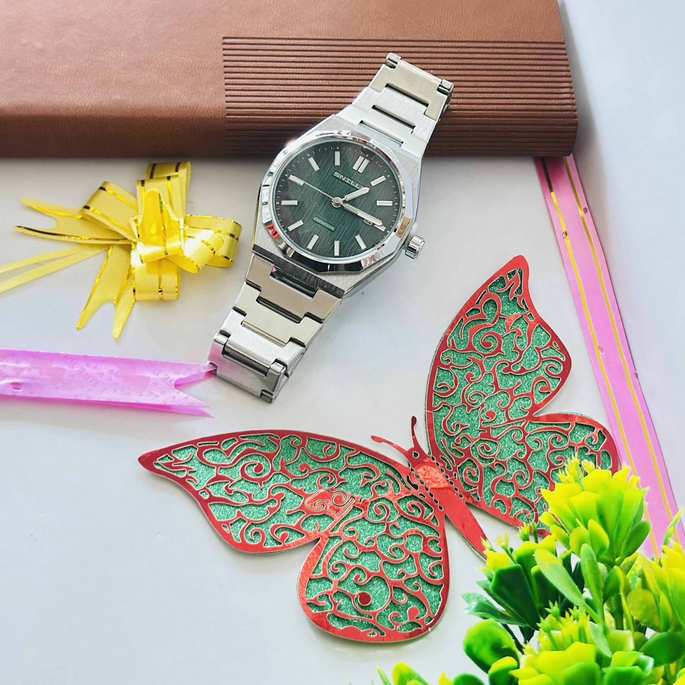 D1 Milano Men Code Automatic with a green analog dial.