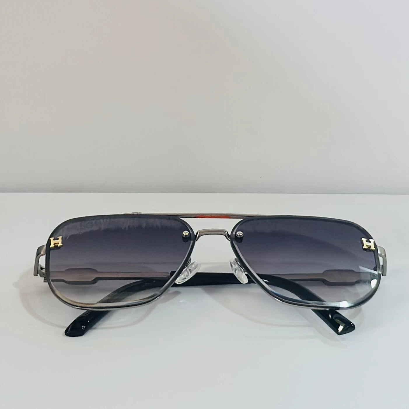 pair of Maybach aviator sunglasses with black and gold details.