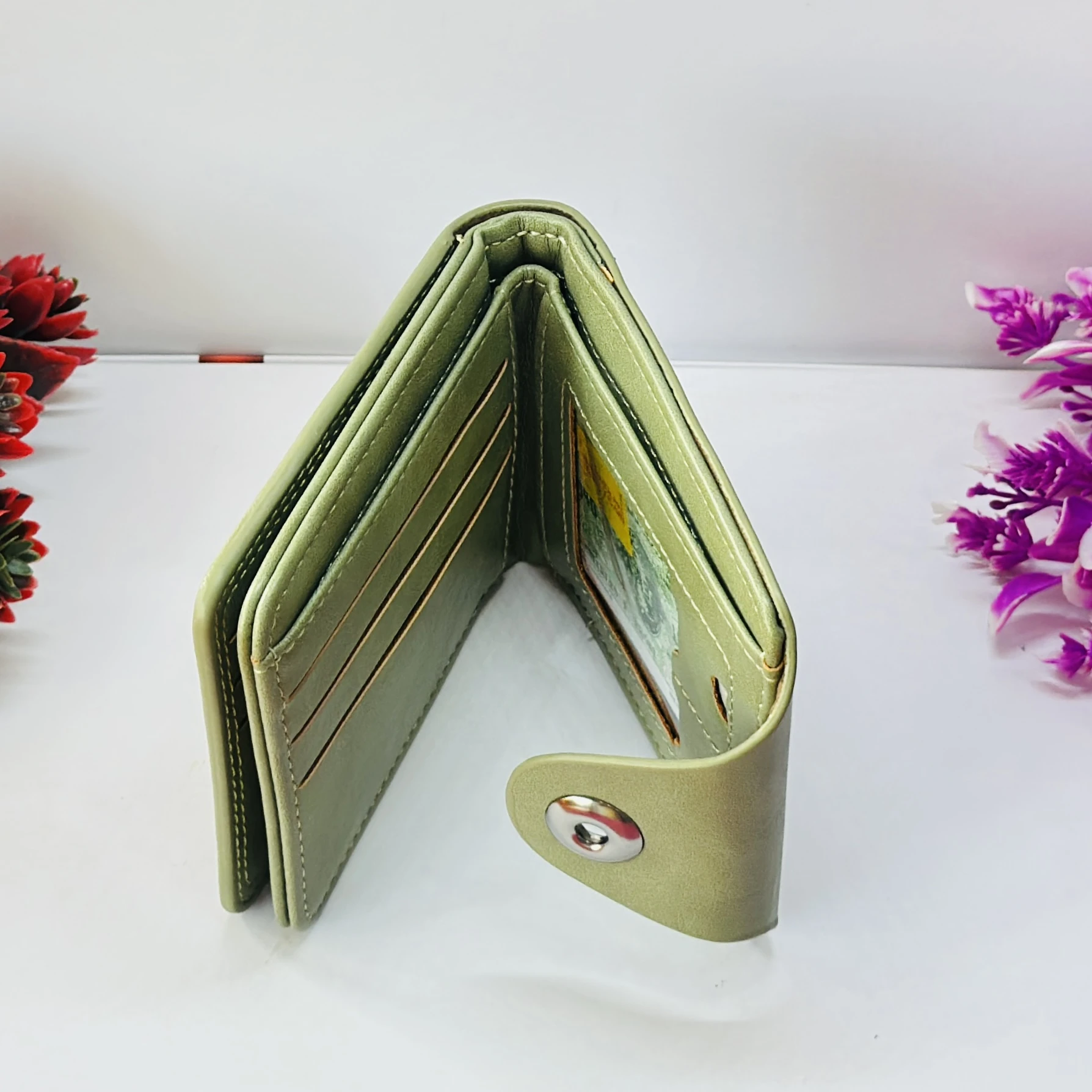 BALISI.CO green bi-fold wallet made from genuine leather.