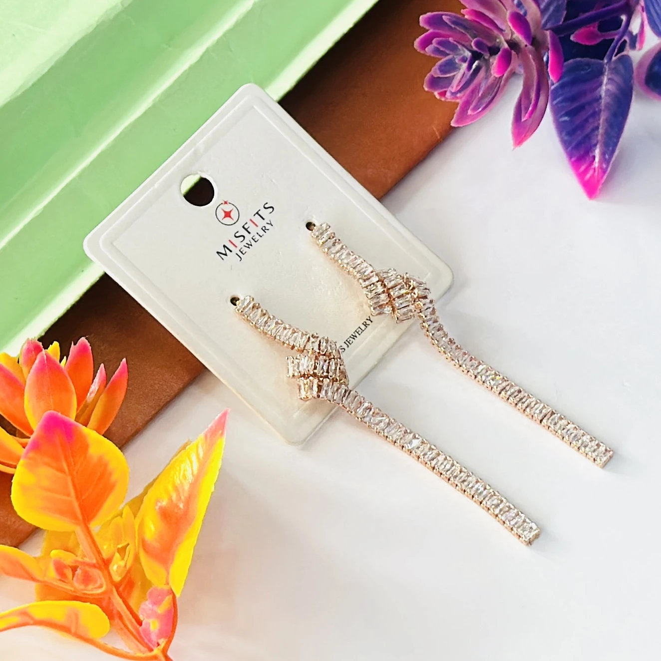 Lovisa gold-plated cubic zirconia baguette knotted drop earrings.