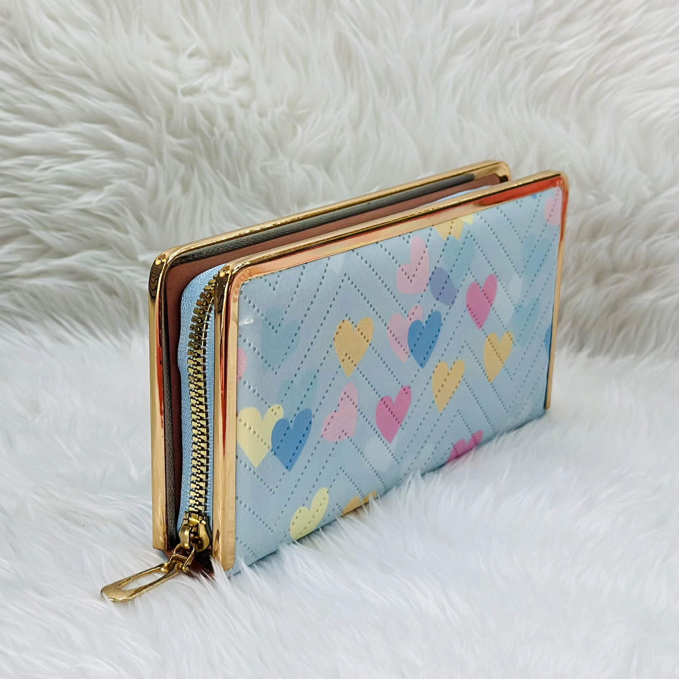 Kyraton women's long wallet with a light blue chevron and multi-colored heart pattern.