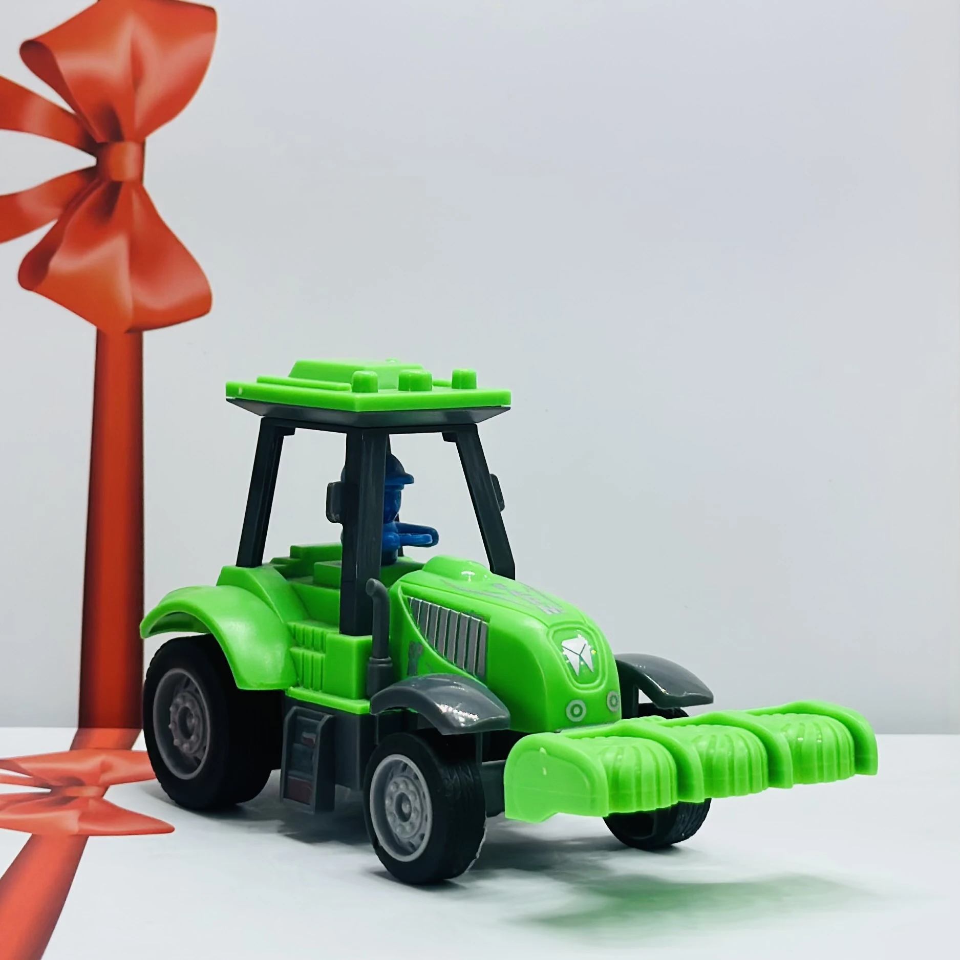 Green plastic toy tractor