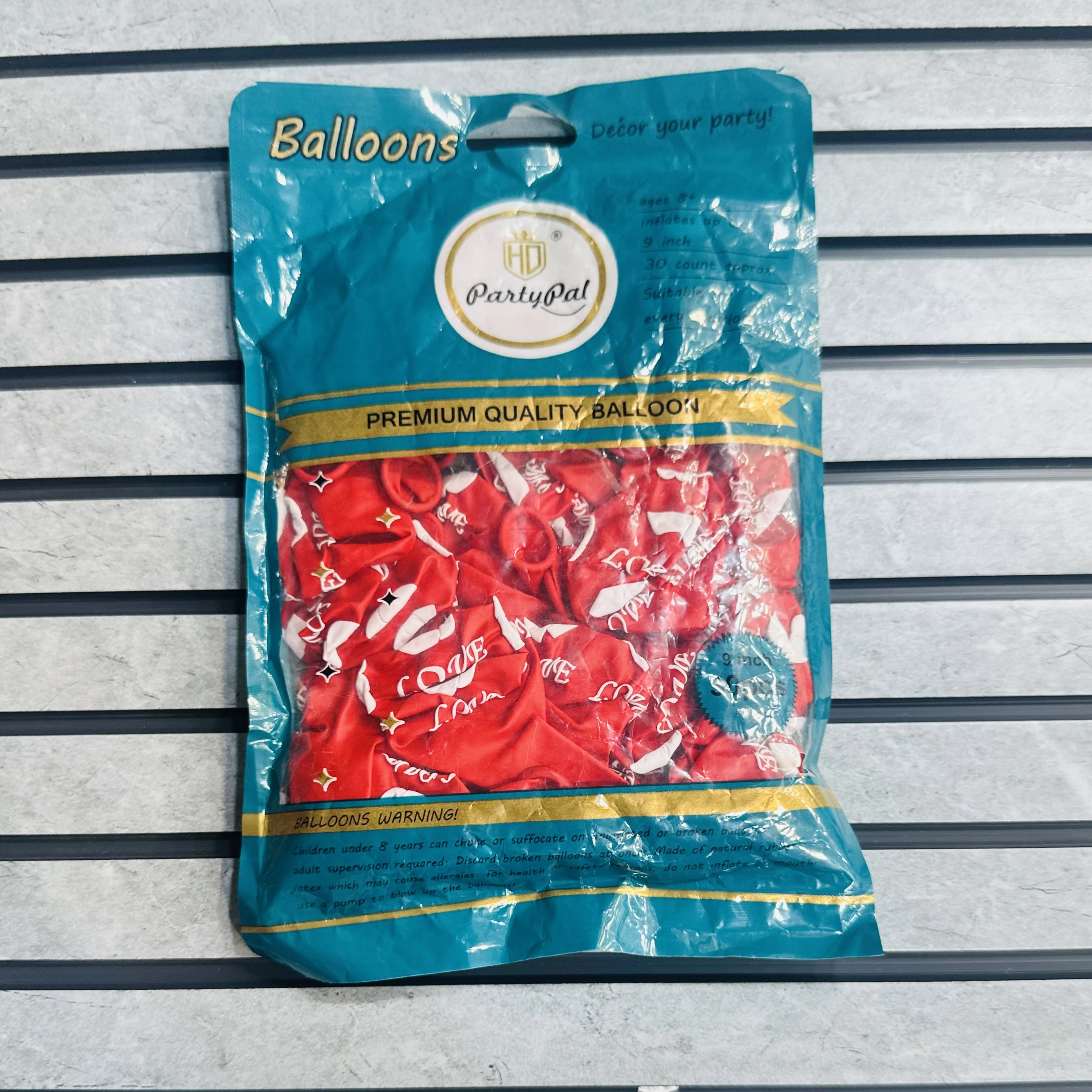 package of red "LOVE" balloons.