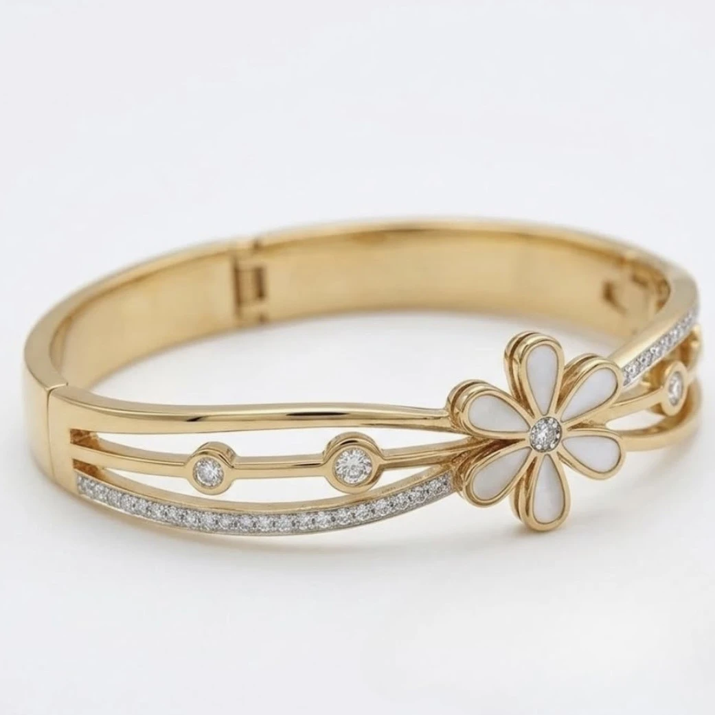 Gold tone hinged bangle bracelet
