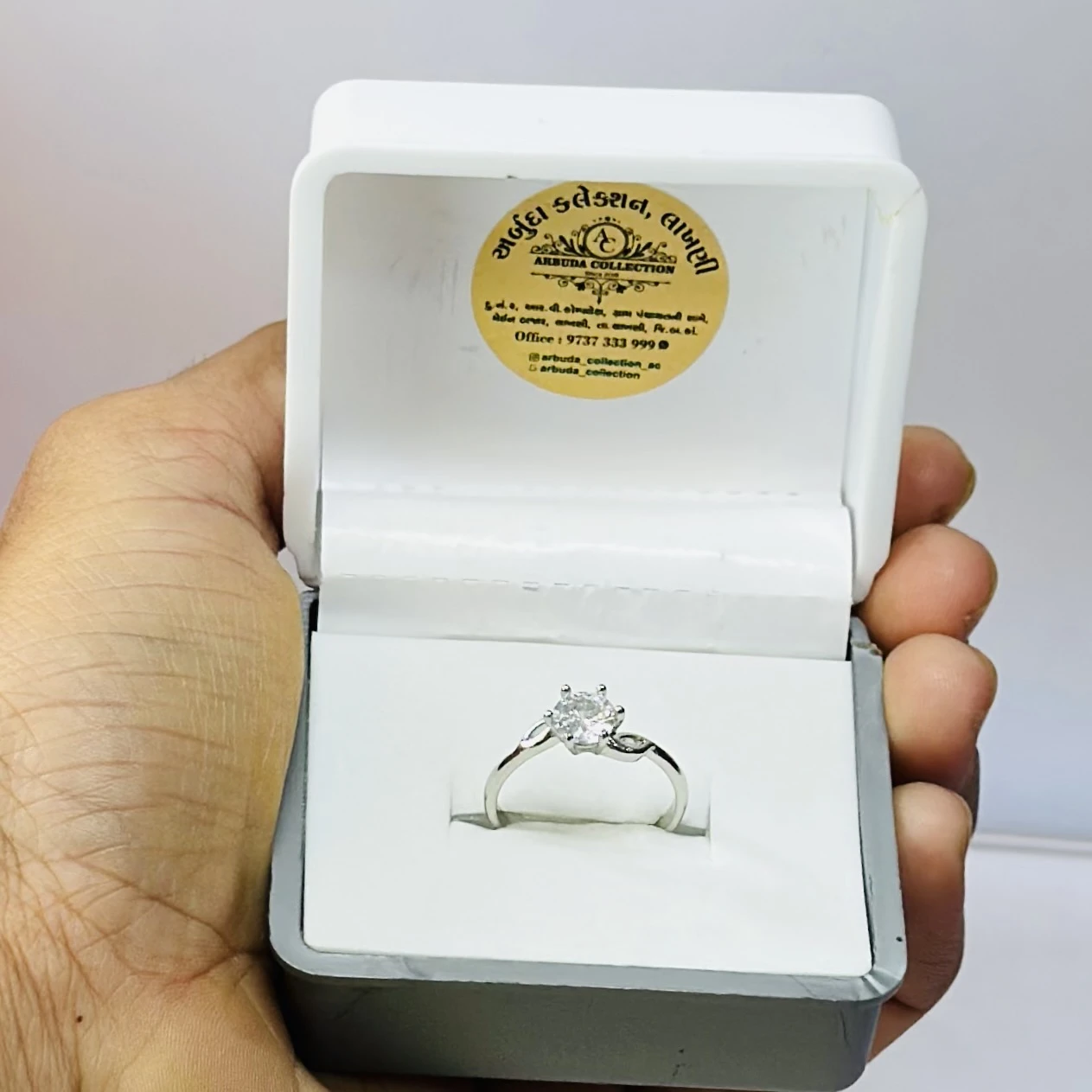 Zavya twisted solitaire rhodium plated 925 sterling silver ring.