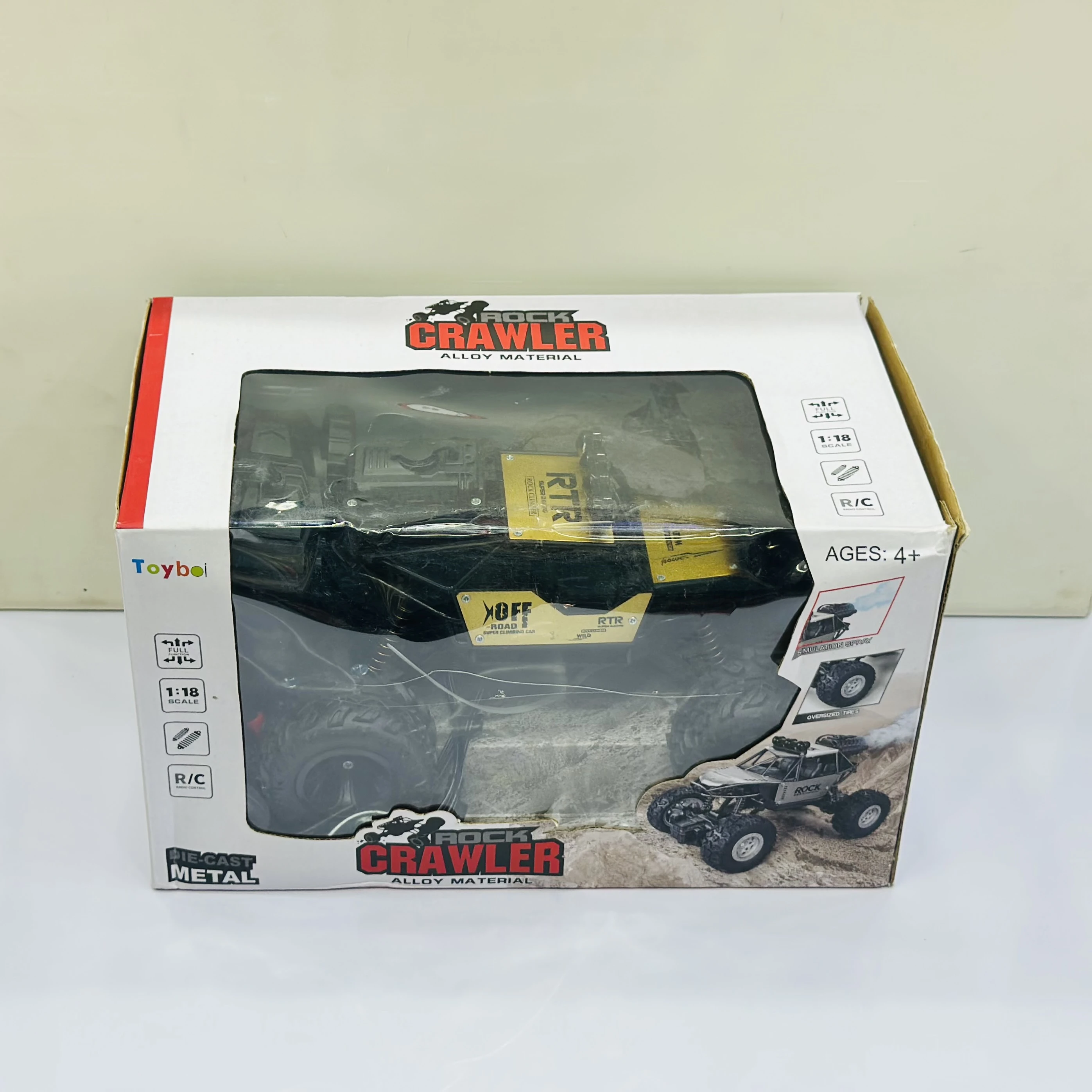 Toyboi 1:18 scale R/C die-cast metal rock crawler toy.