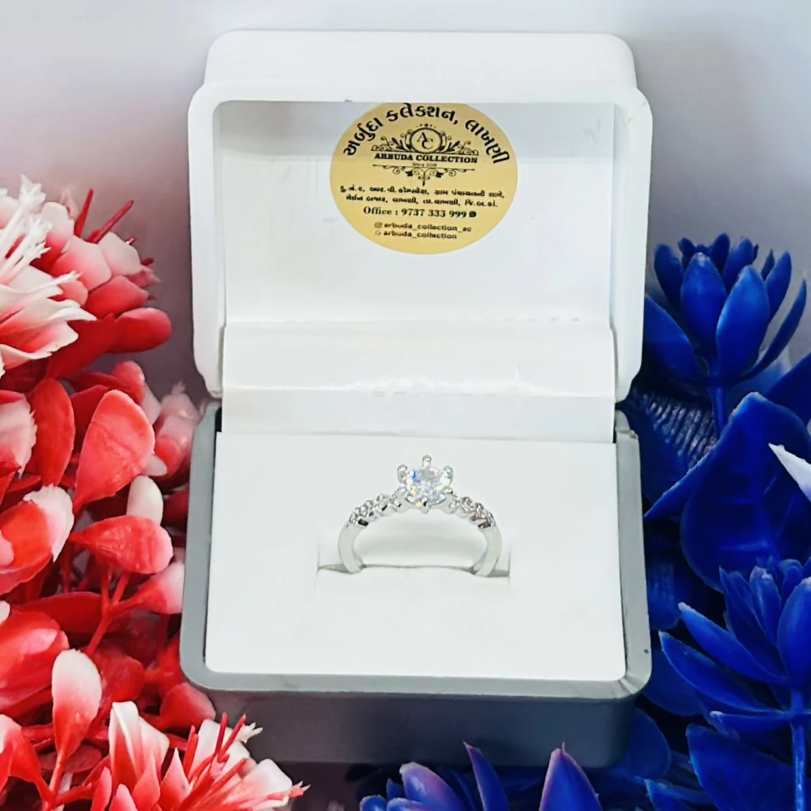 Silver ring with cubic zirconia stones.