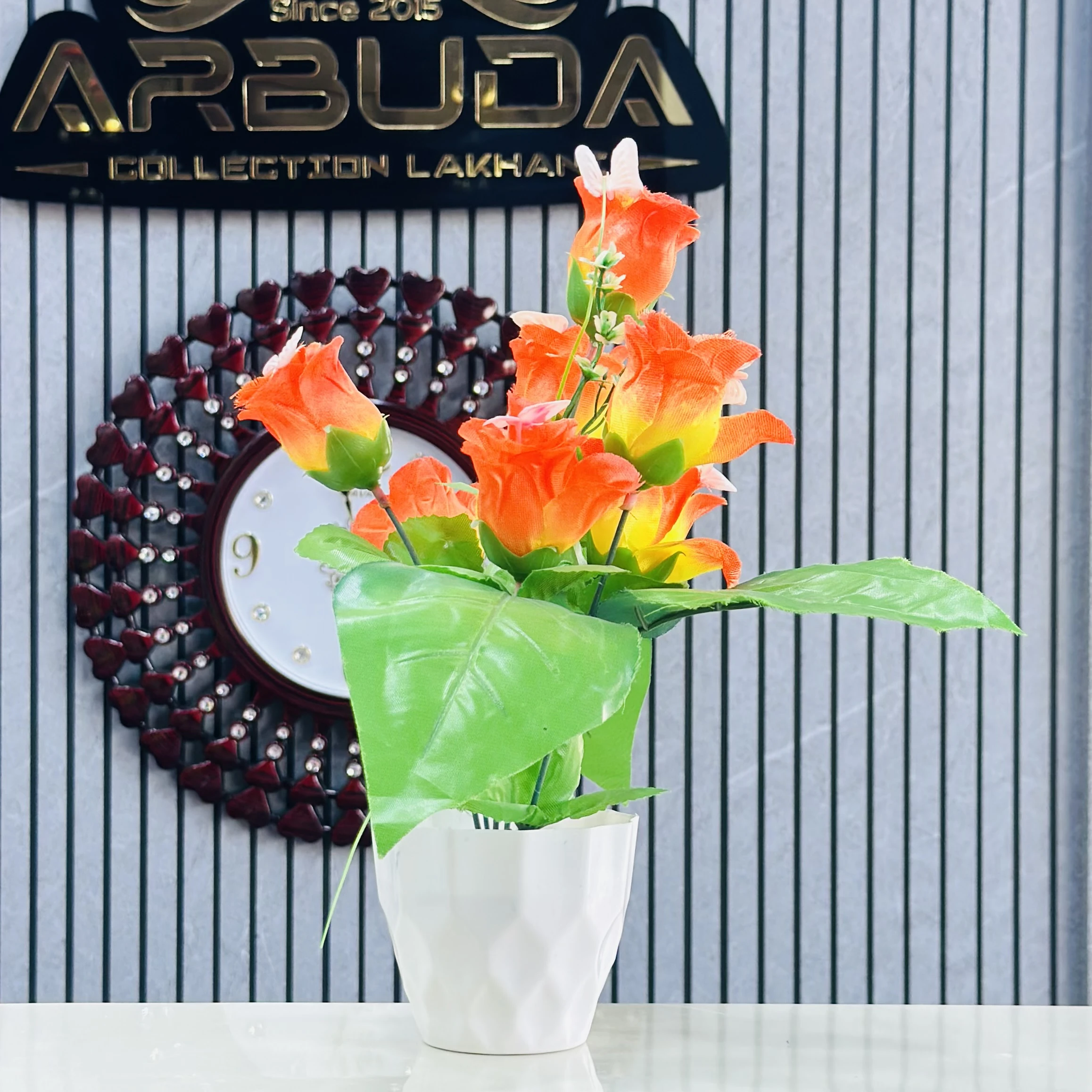 Apple Rose artificial flower bunch with a white pot.