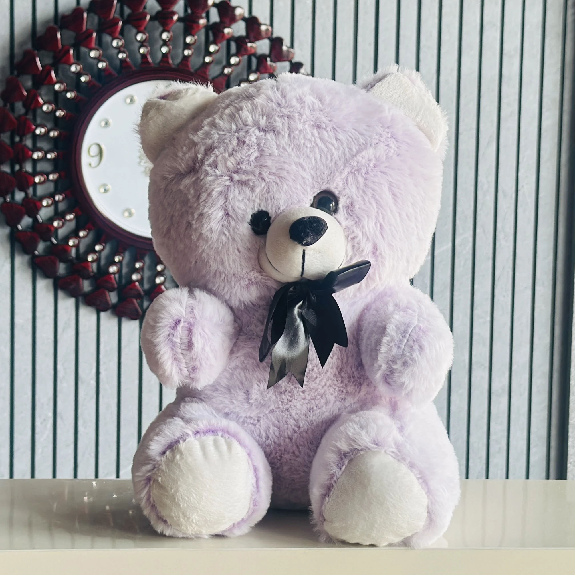 Soft purple plush teddy bear.