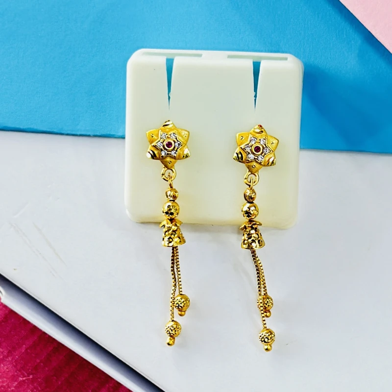 pair of intricate gold drop earrings