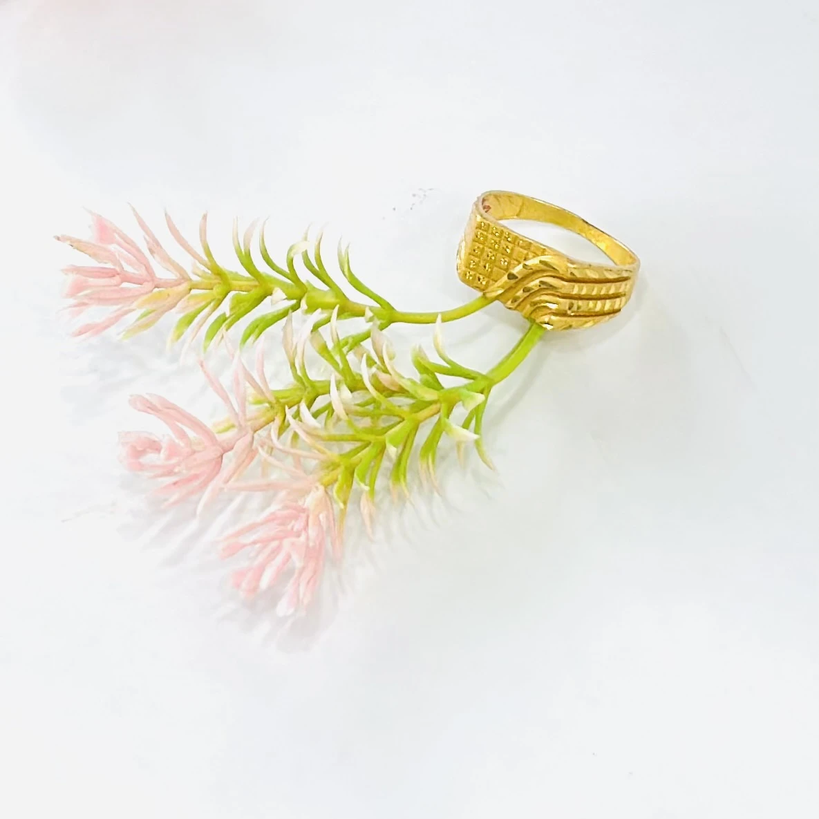 Gold toned finger ring