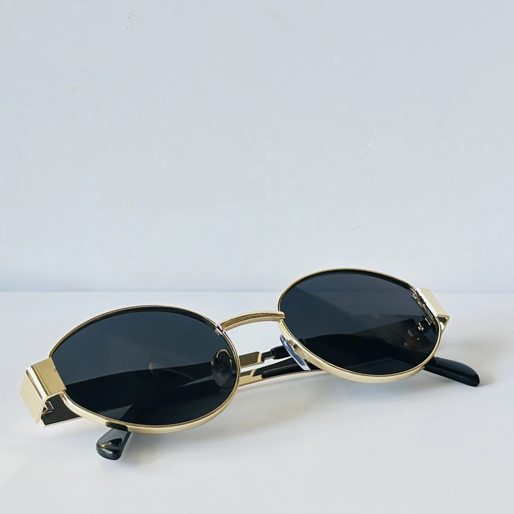 classic gold-framed oval sunglasses