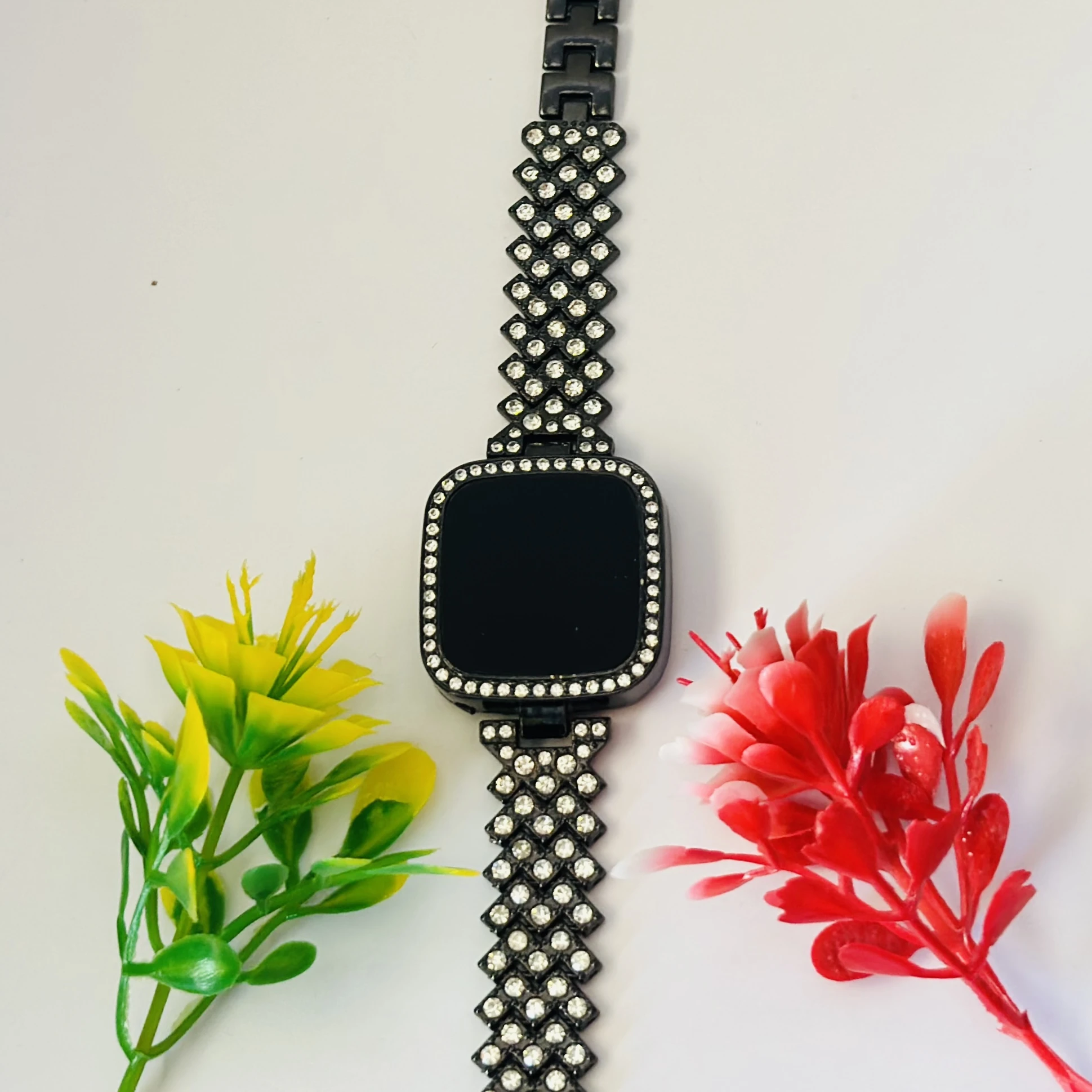 Black LED digital watch with a rhinestone bracelet.