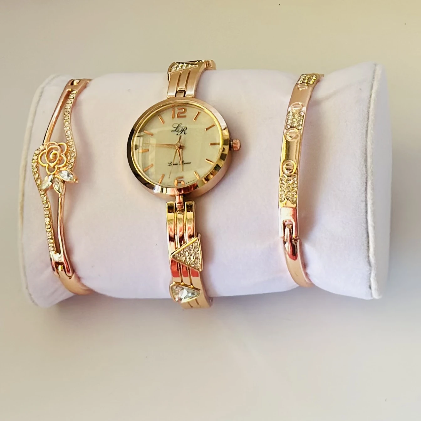 women's watch and bracelet set in rose gold color.
