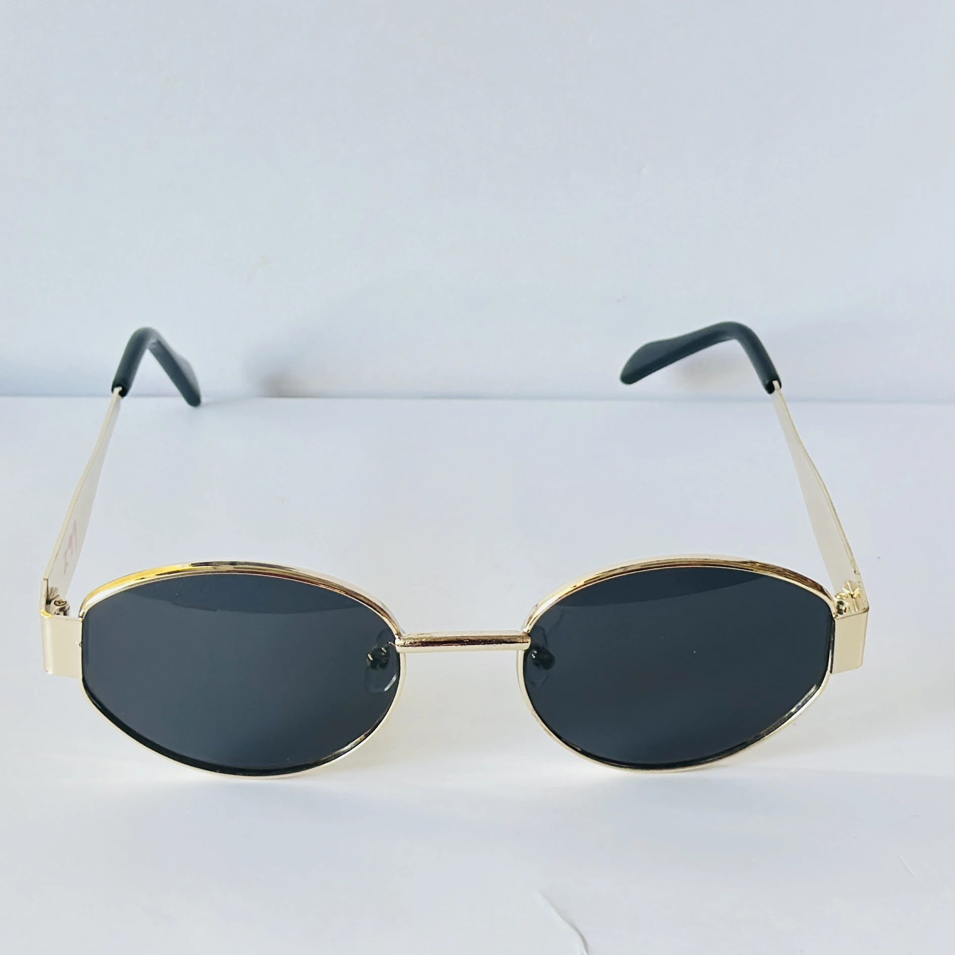 classic gold-framed oval sunglasses