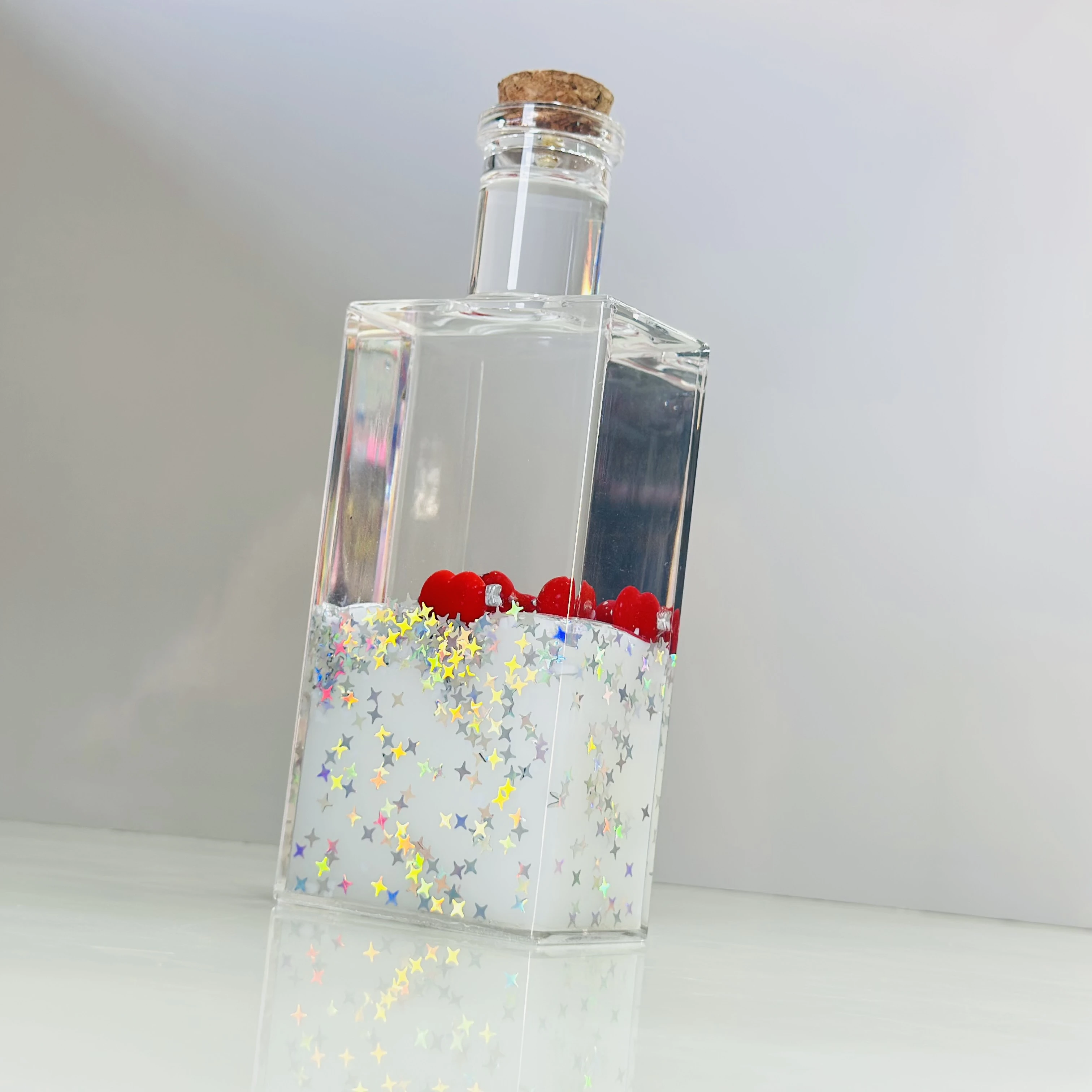 decorative fluid bottle with hearts and stars. (SKU-ATDL7R)