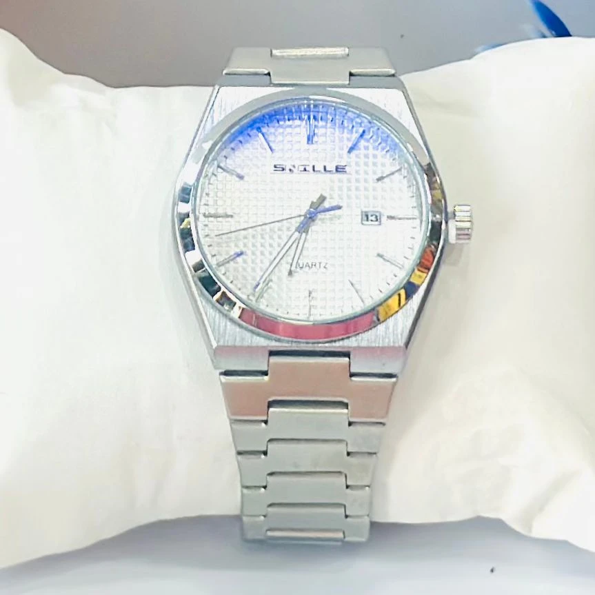 analog watch with a white dial and date function.