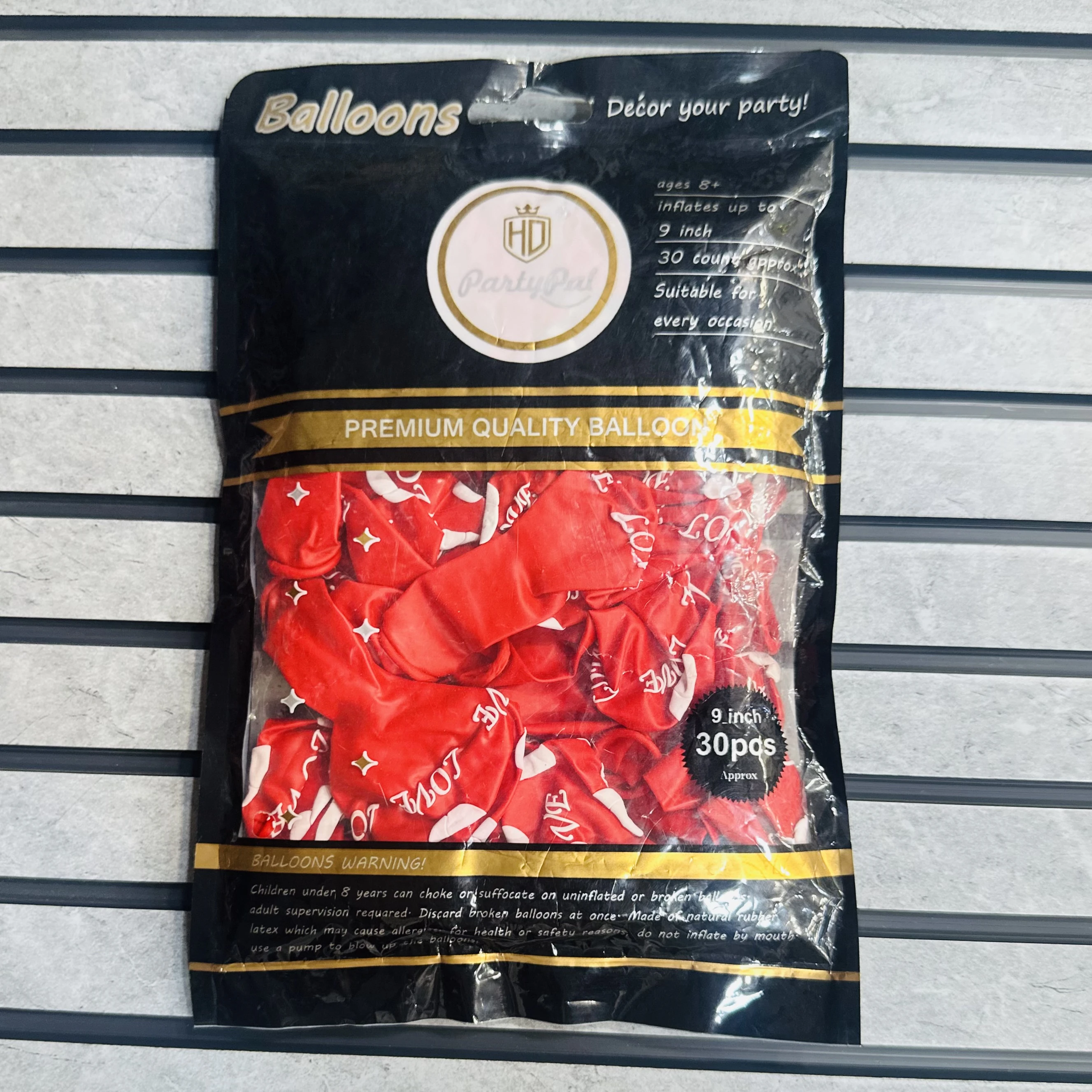 package of red "LOVE" balloons.