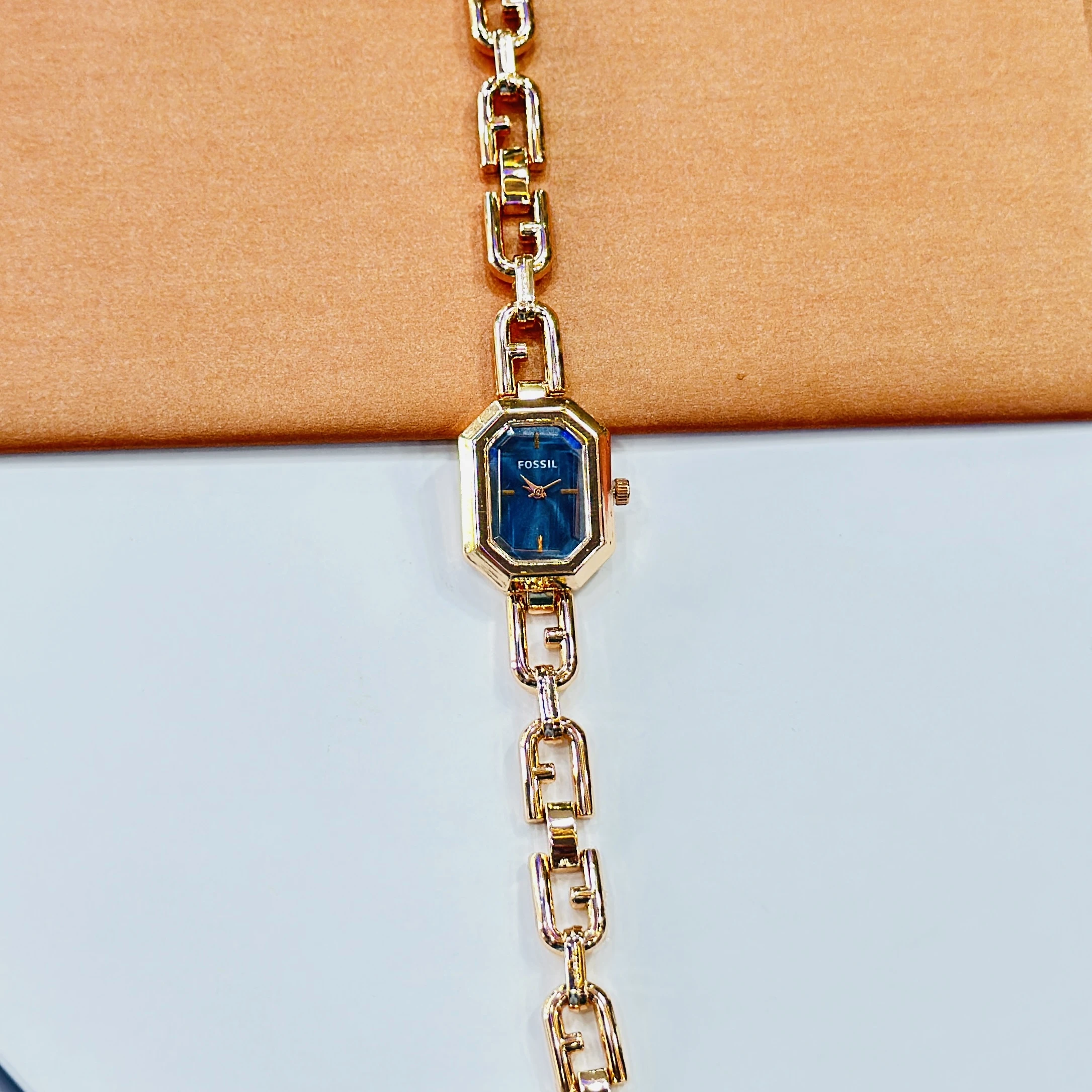Fossil Harlow chain bracelet watch with a blue dial.
