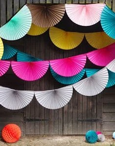 package of "Happy Forever" brand paper fan garland party decorations.
