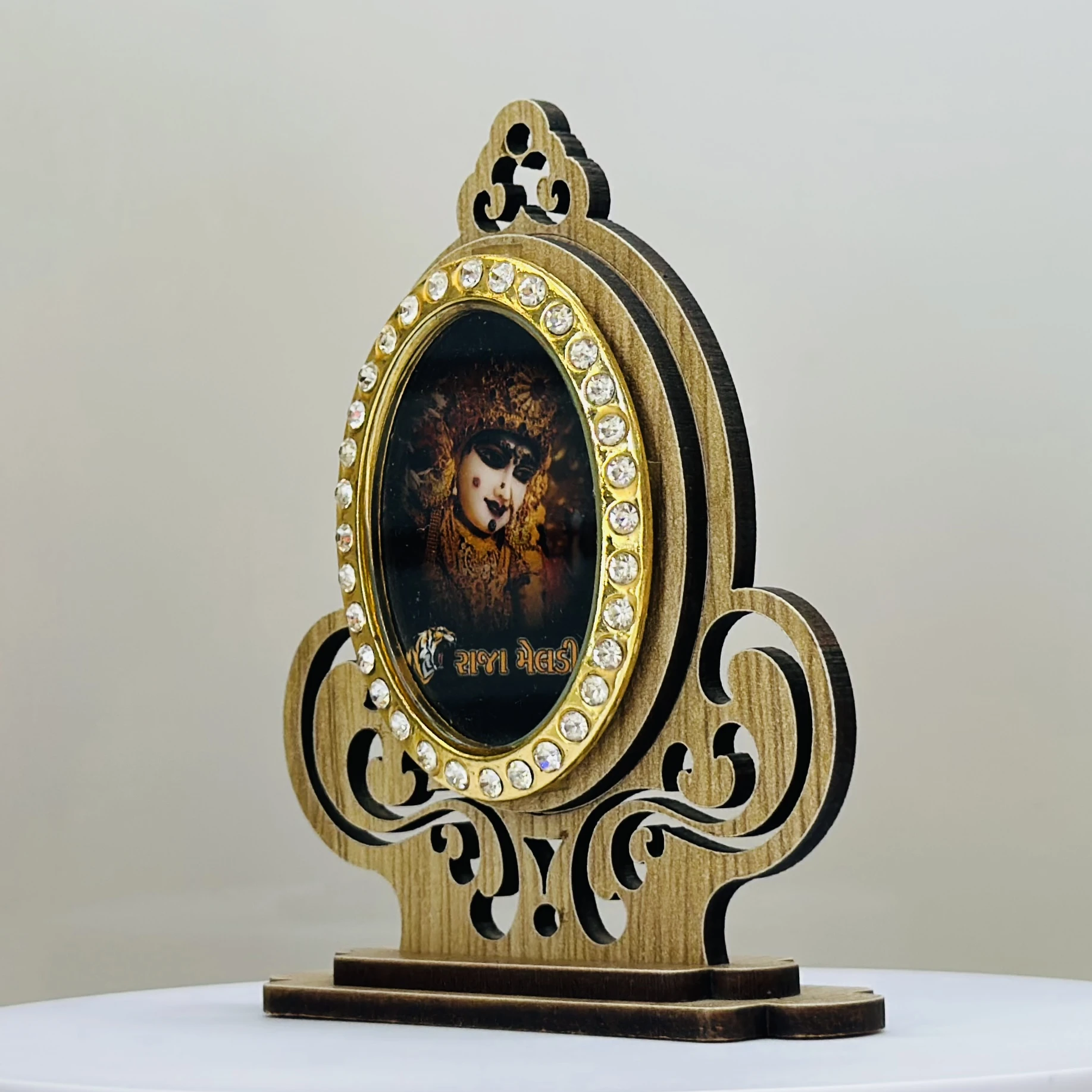 wooden showpiece featuring the Hindu deity Raja Meldi