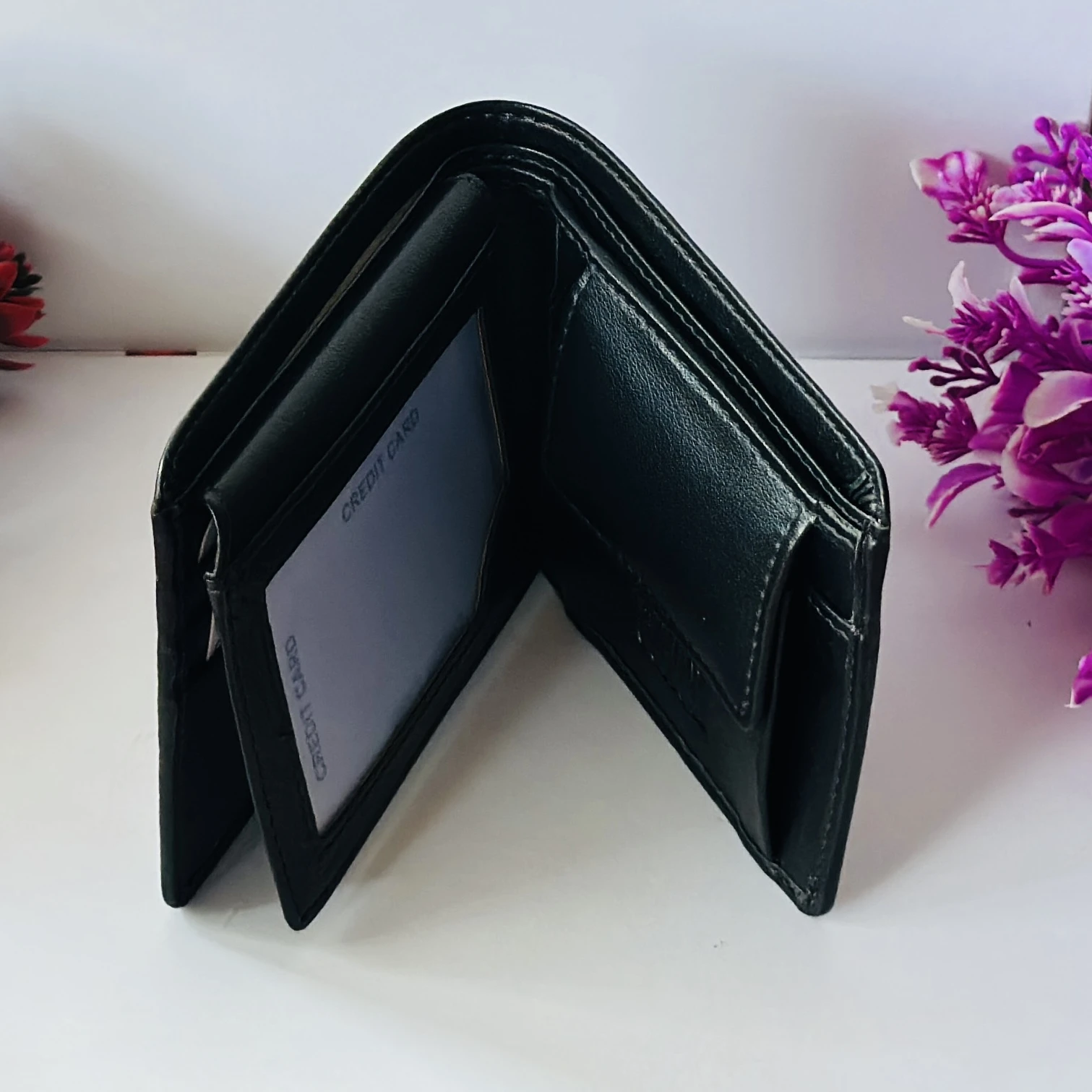 Black genuine leather bifold wallet from Coach.
