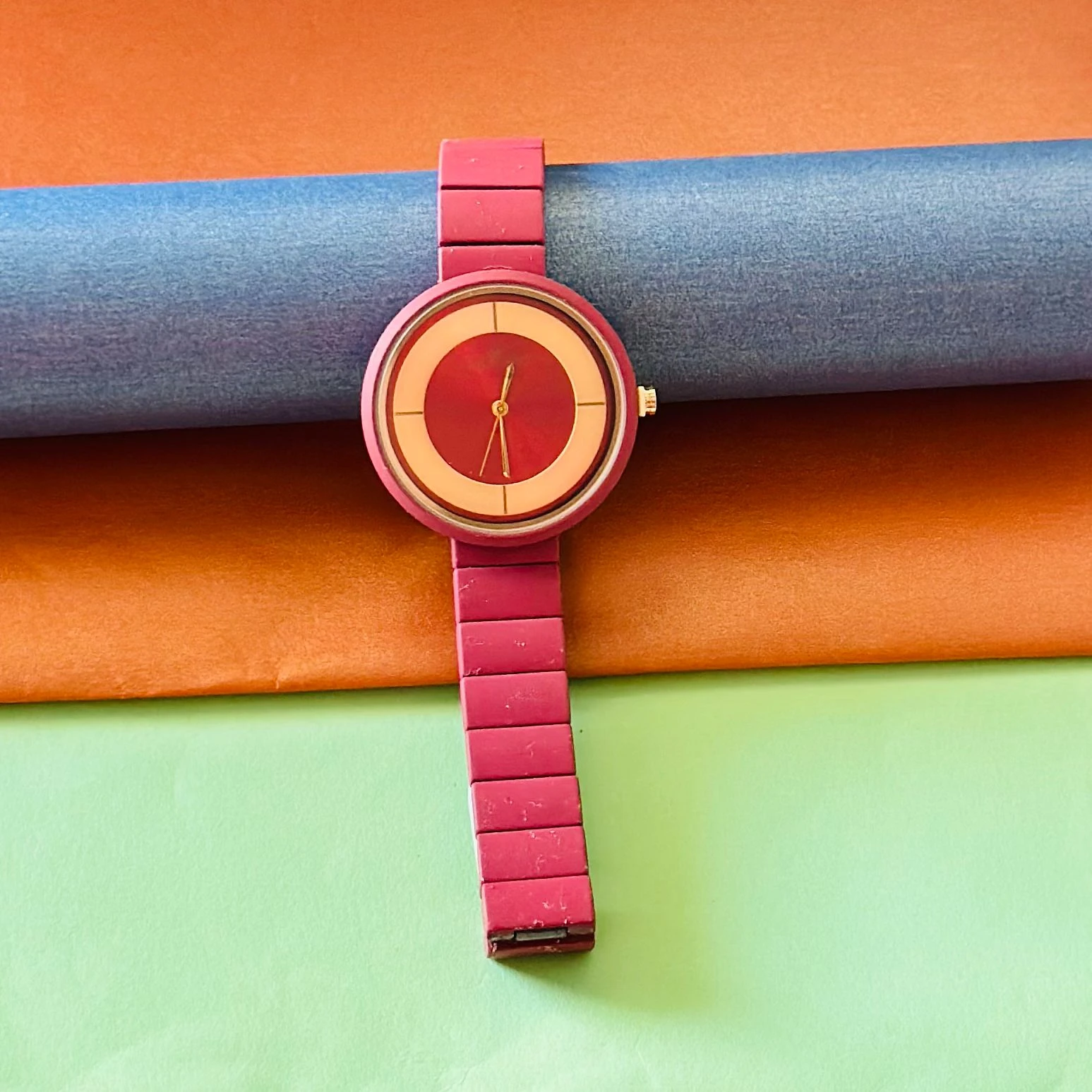 burgundy or red analogue watch for women, possibly from brands like Fastrack or Watchstar