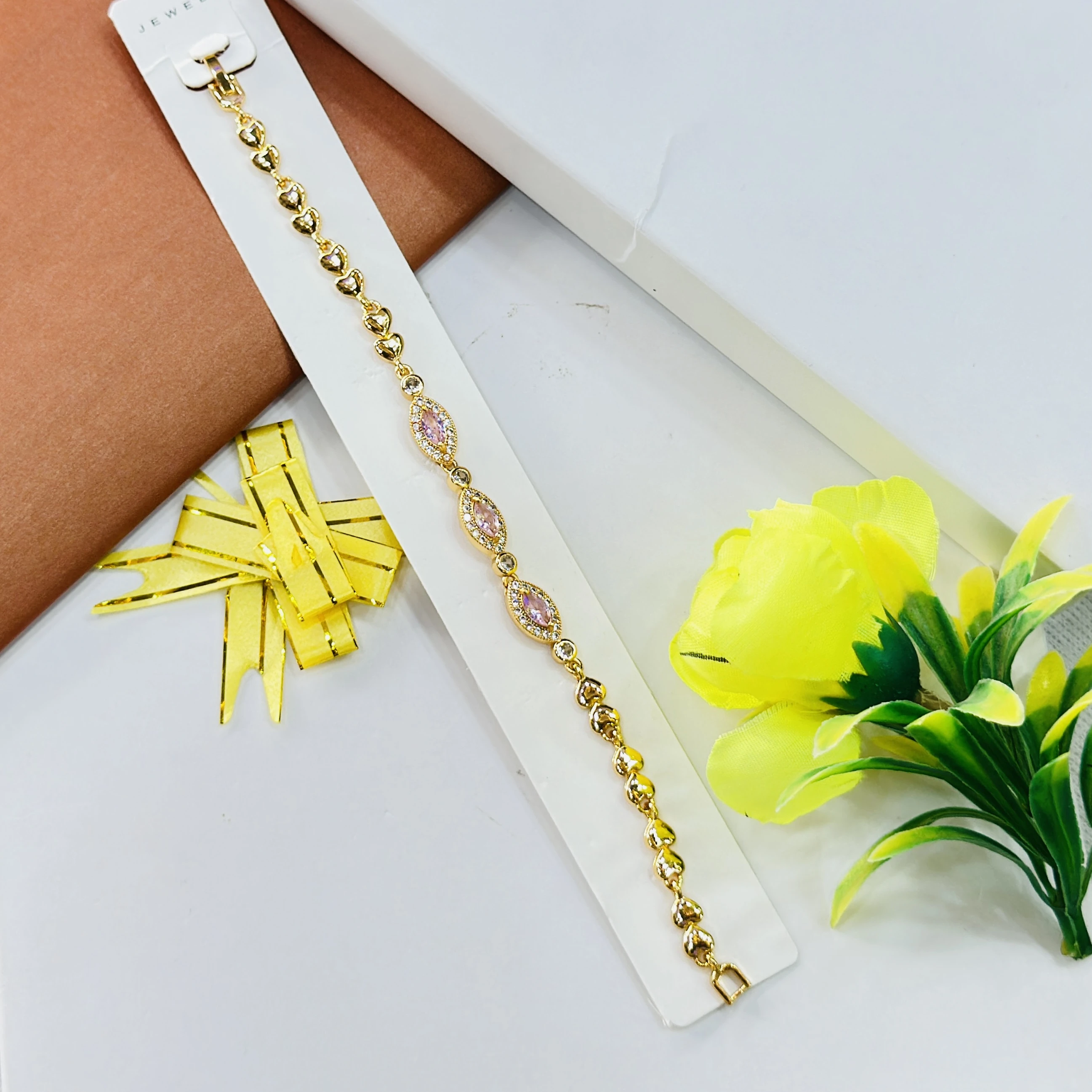 gold-plated bracelet featuring small heart-shaped links