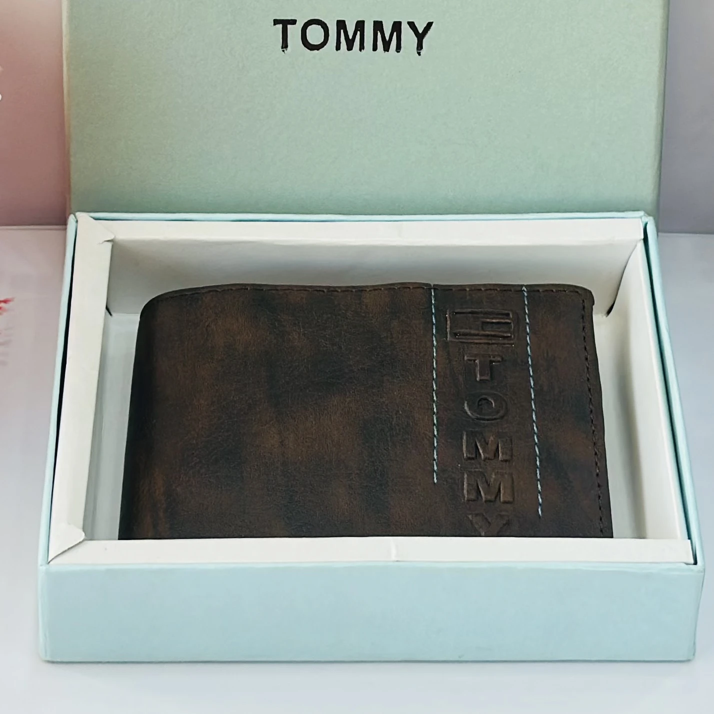 Brown bifold wallet from the brand Tommy.