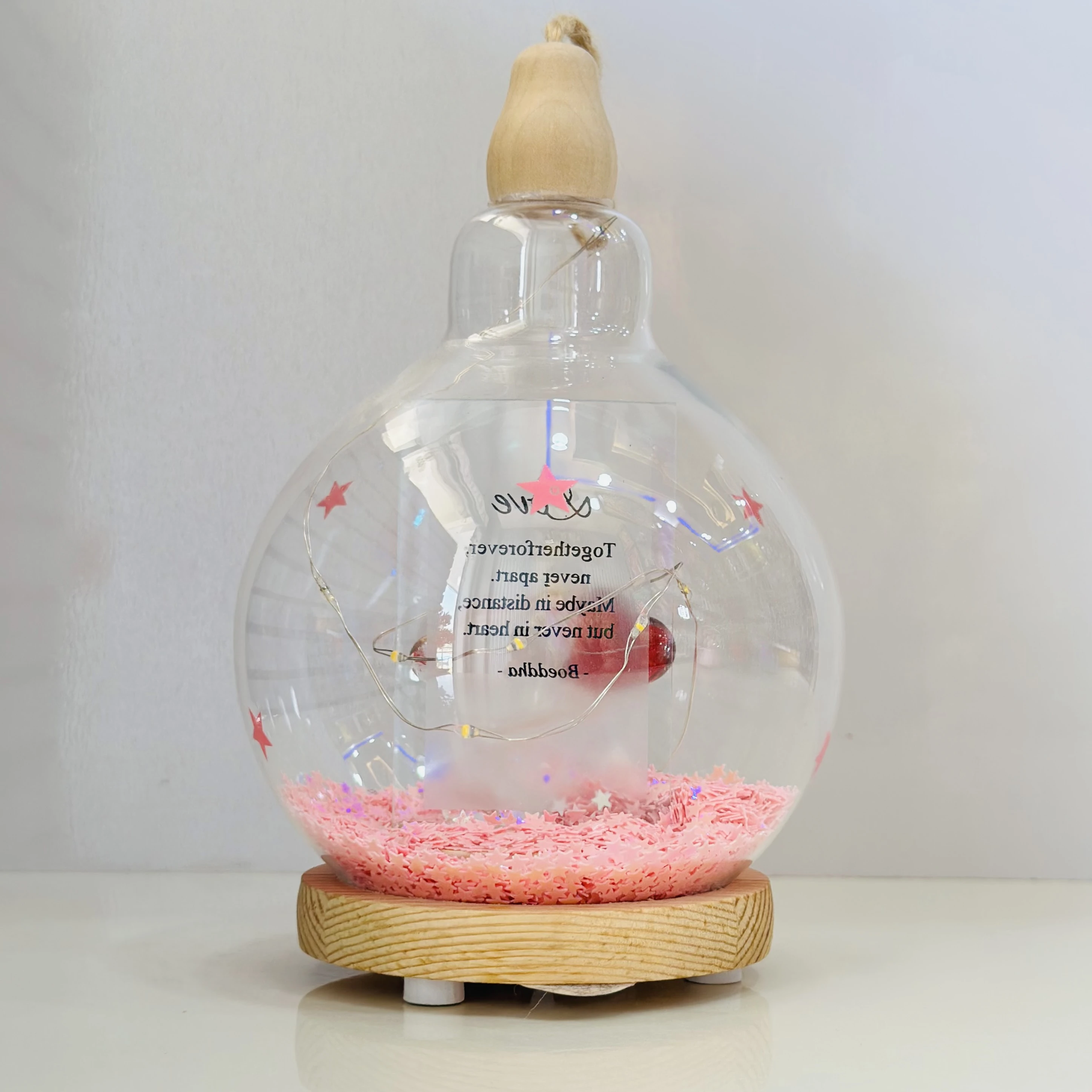 decorative glass dome with LED lights, featuring a couple figurine inside.(SKU-5NELVH)