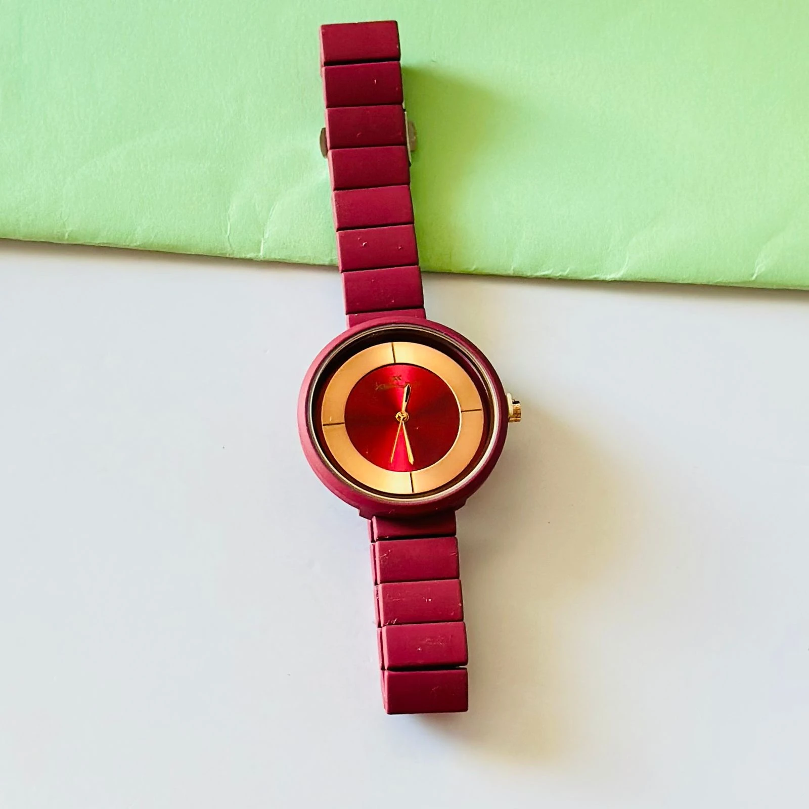 burgundy or red analogue watch for women, possibly from brands like Fastrack or Watchstar
