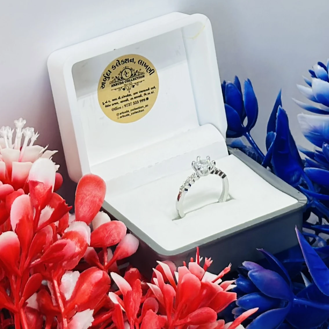 Silver ring with cubic zirconia stones.