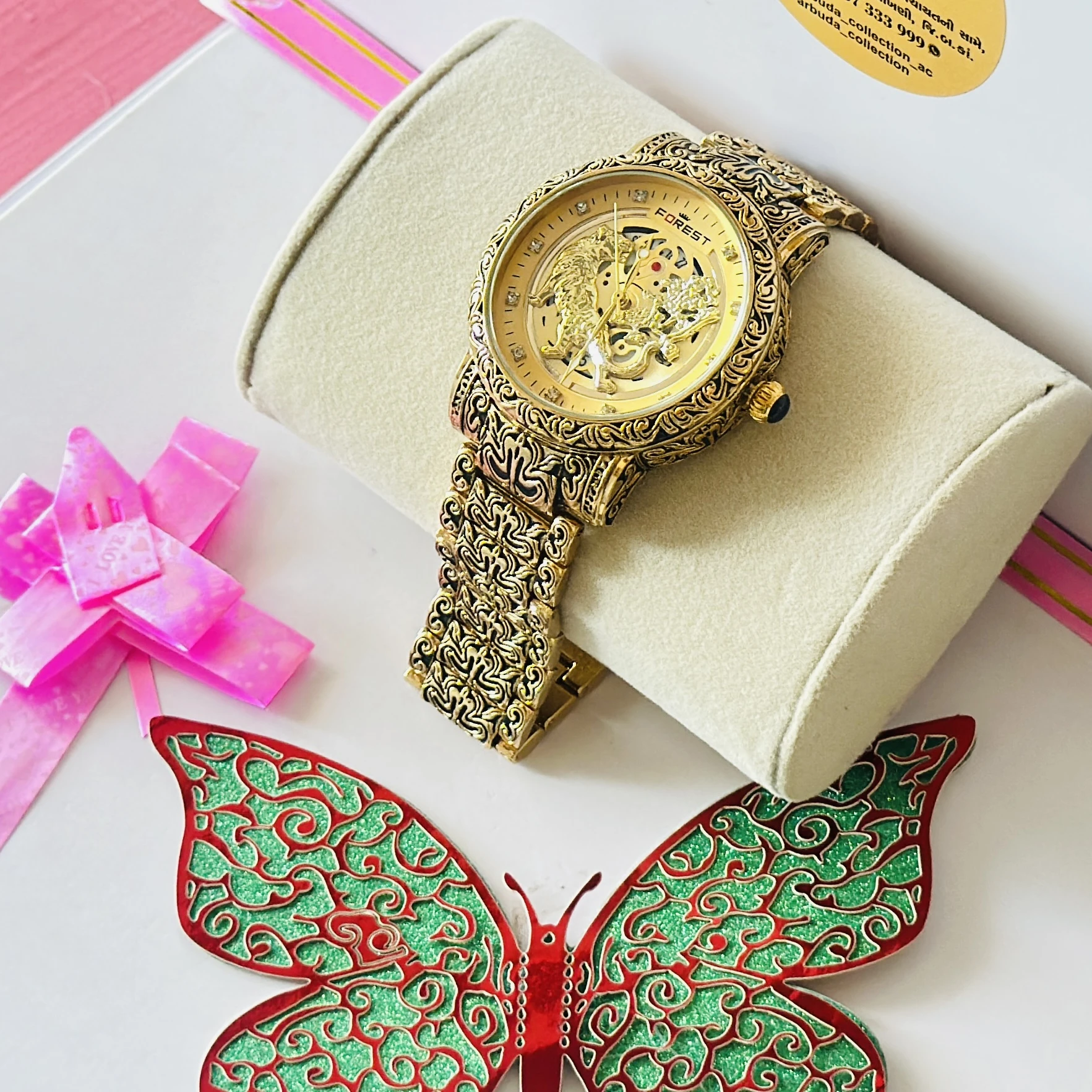 Forest Luxury Gold-Tone Tiger Skeleton Dial Watch with an engraved pattern band.