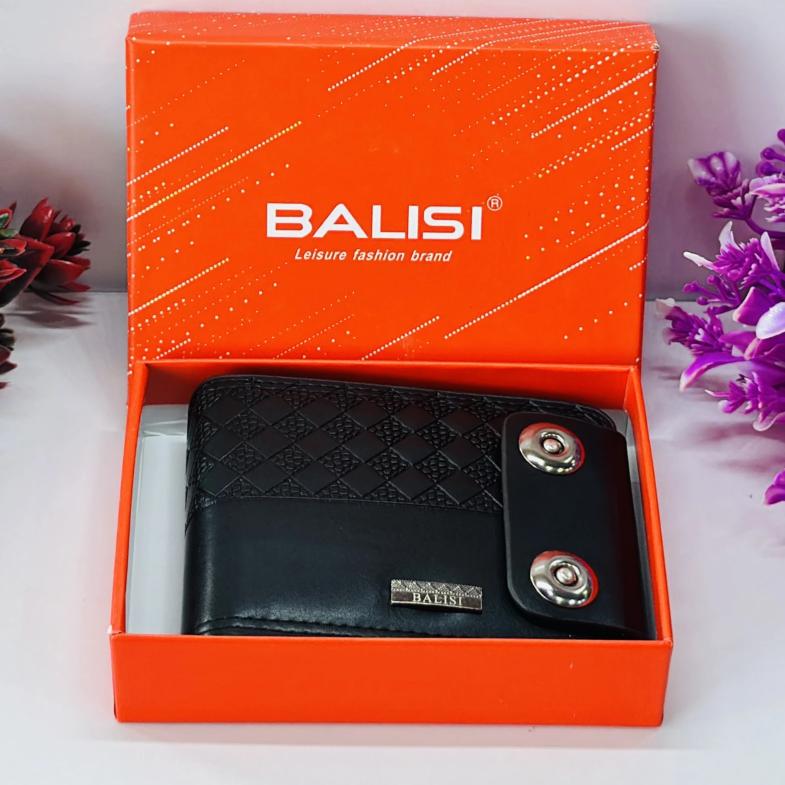 Black bi-fold men's wallet with a snap closure, branded as "Balisi".