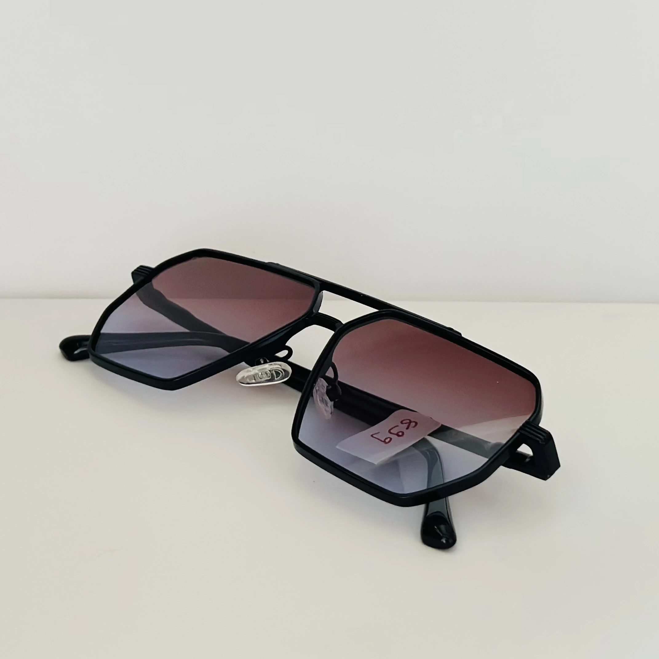 Black retro-style square sunglasses for men with gradient lenses.