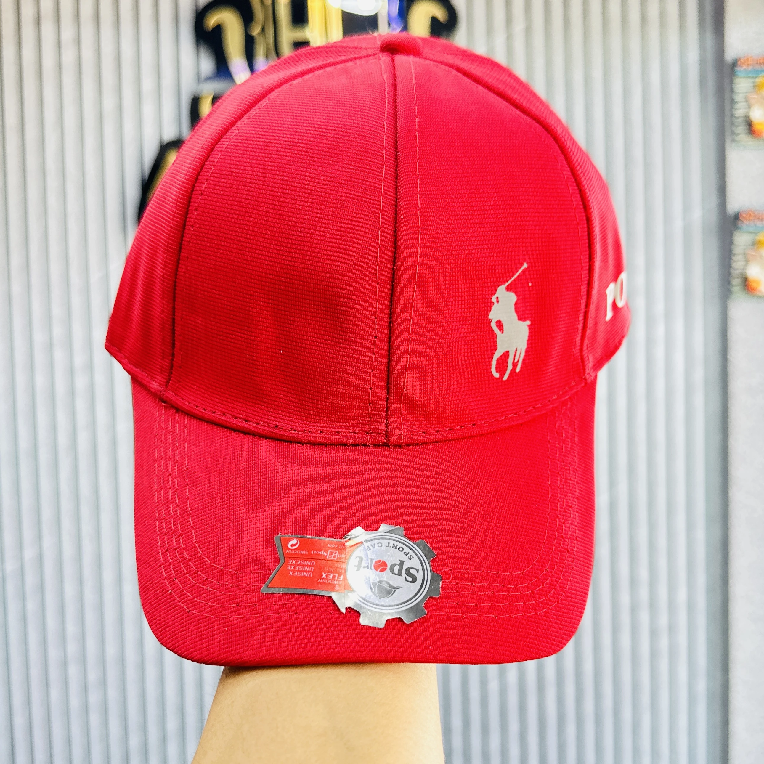 appears to be a red baseball-style cap