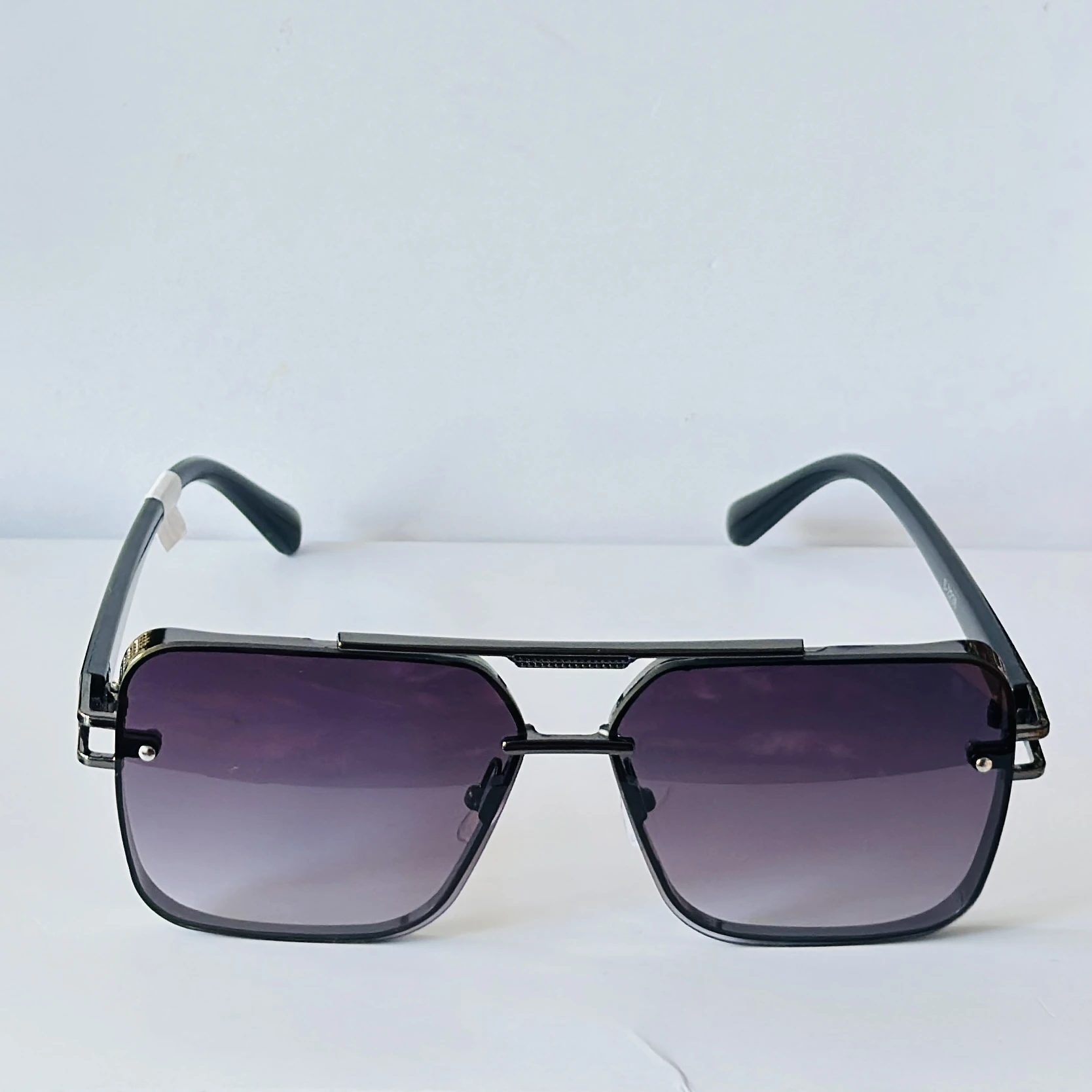 appear to be retro square or modern pilot-style sunglasses for men