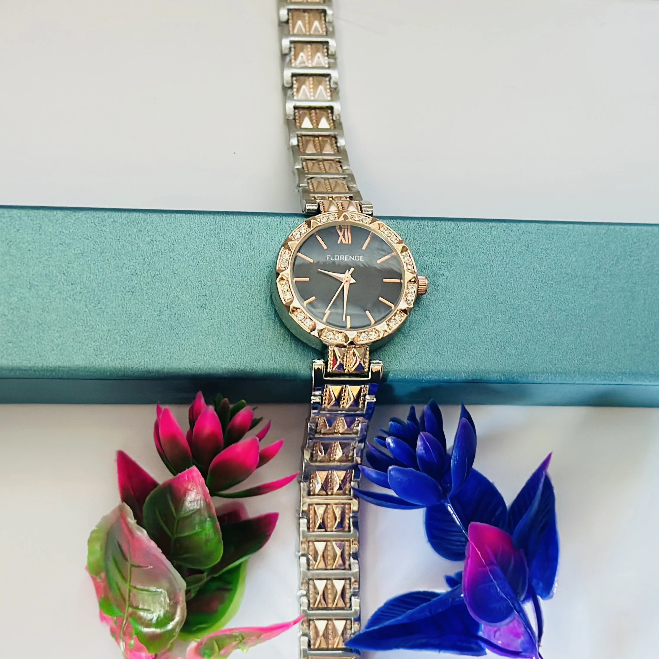 women's analog watch with a two-tone (silver and rose gold) metal strap