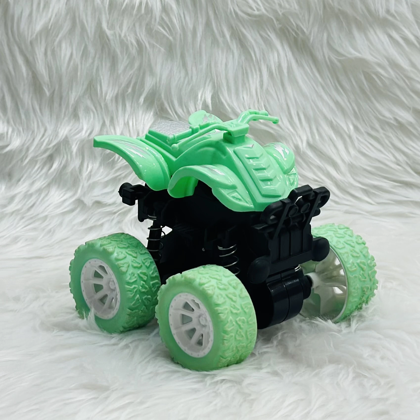 mini monster truck toy, which is typically a friction-powered stunt car.