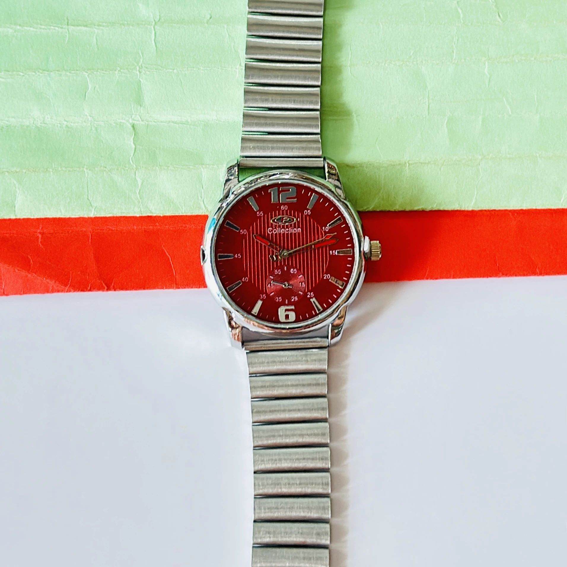 Red dial analog watch