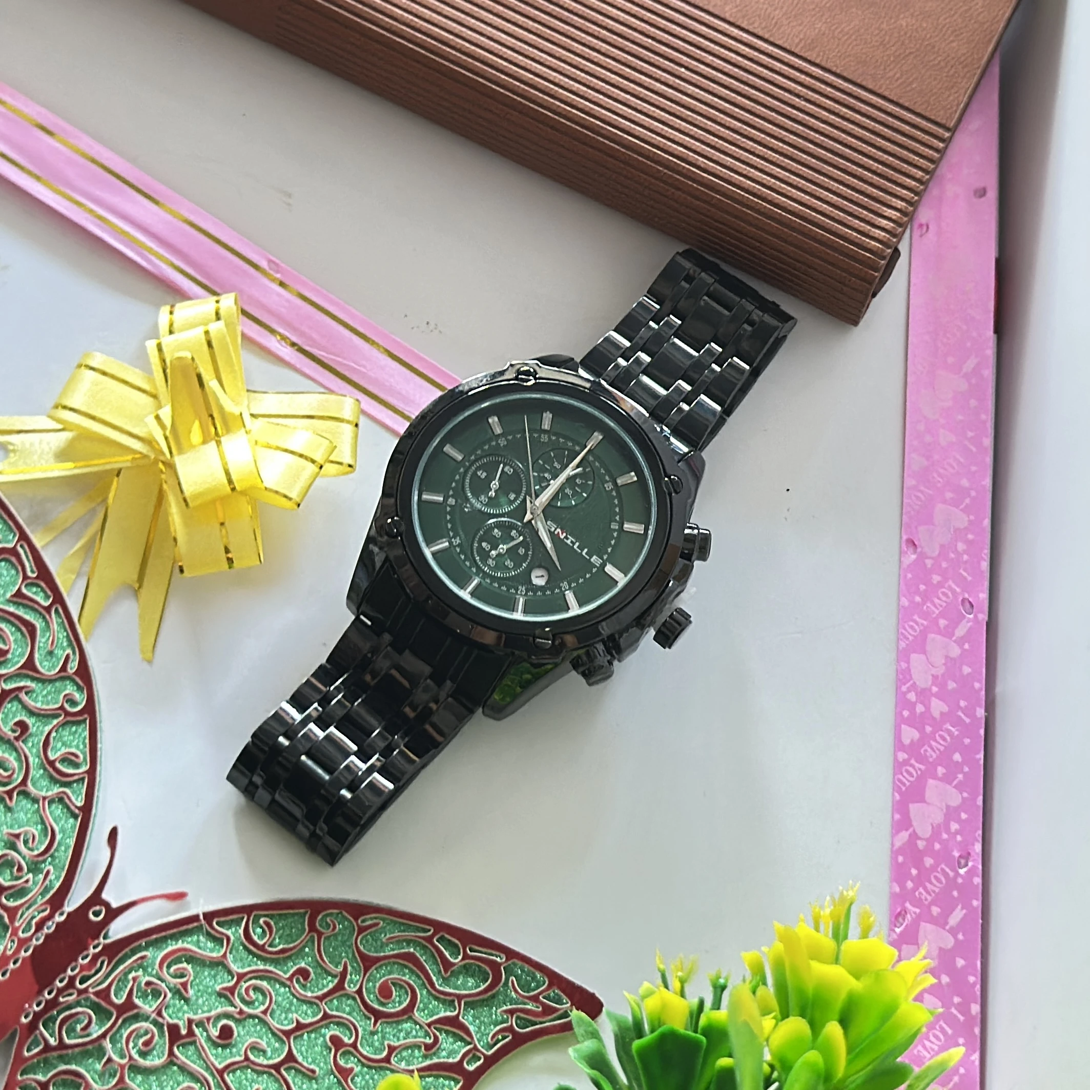 Black analog wristwatch with a metallic strap