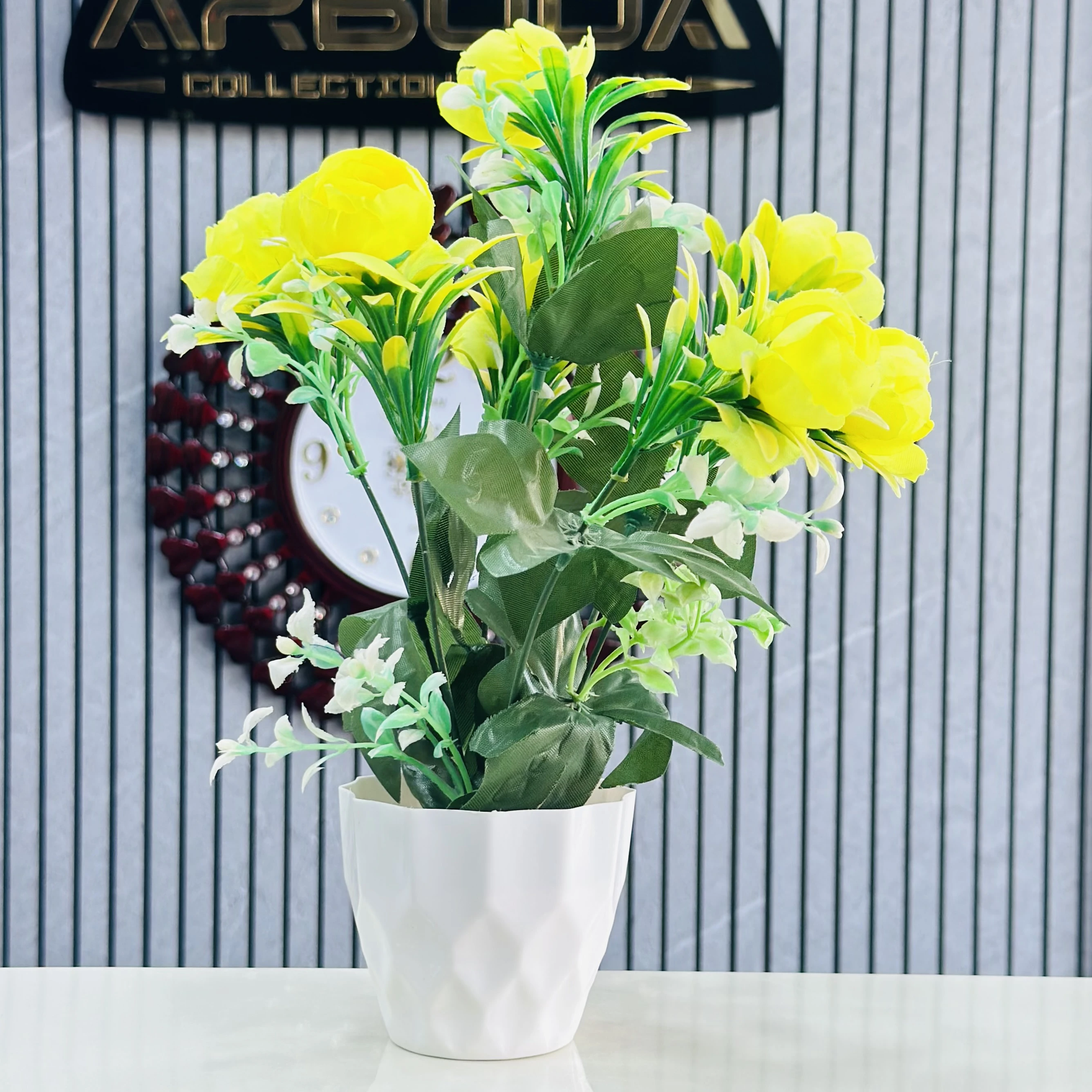plant for decoration with yellow flowers and a white pot.